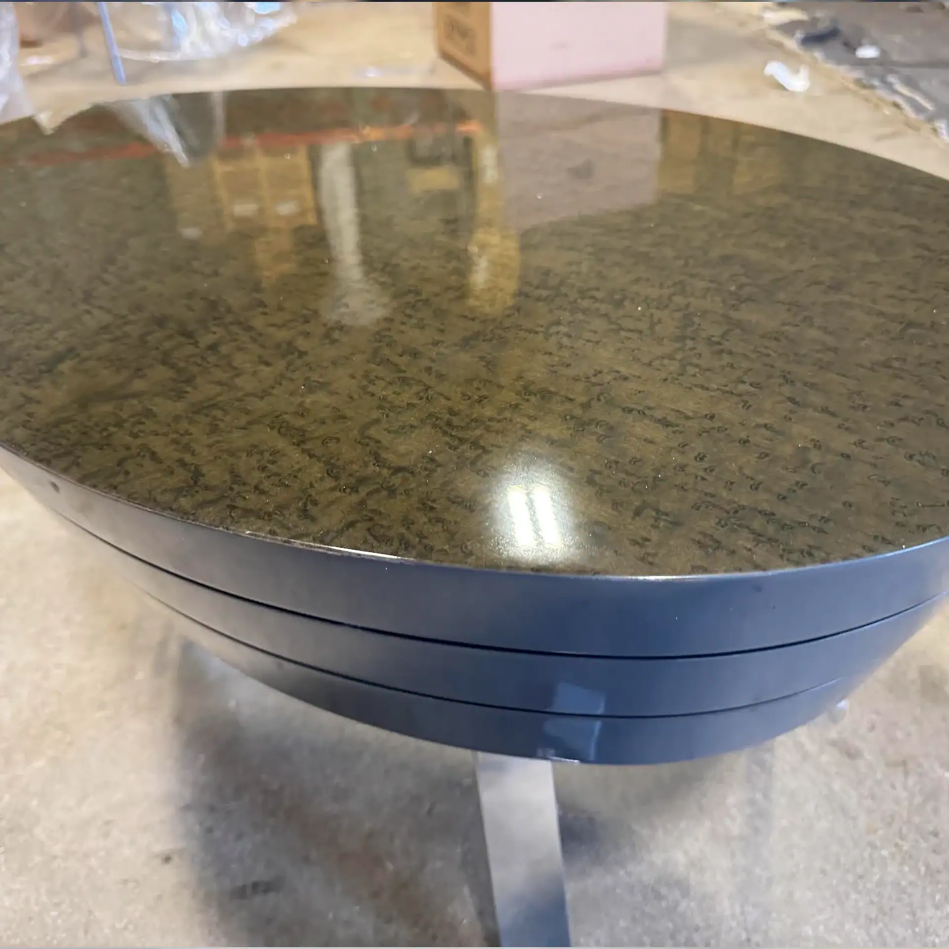 Sklar Furnishings John Low Table with dark marble top and metal base.