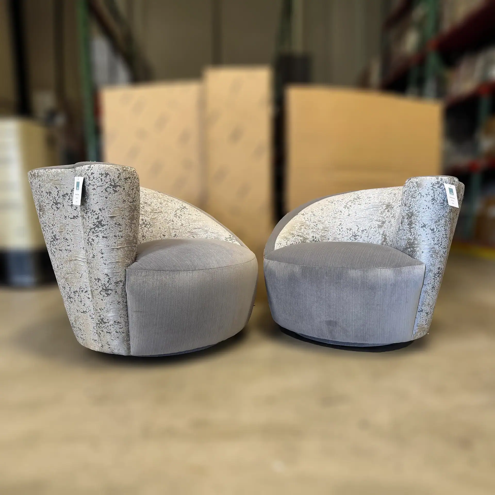 Sklar Furnishings Lazar Scroll Swivel Chairs set of 2 in a warehouse.