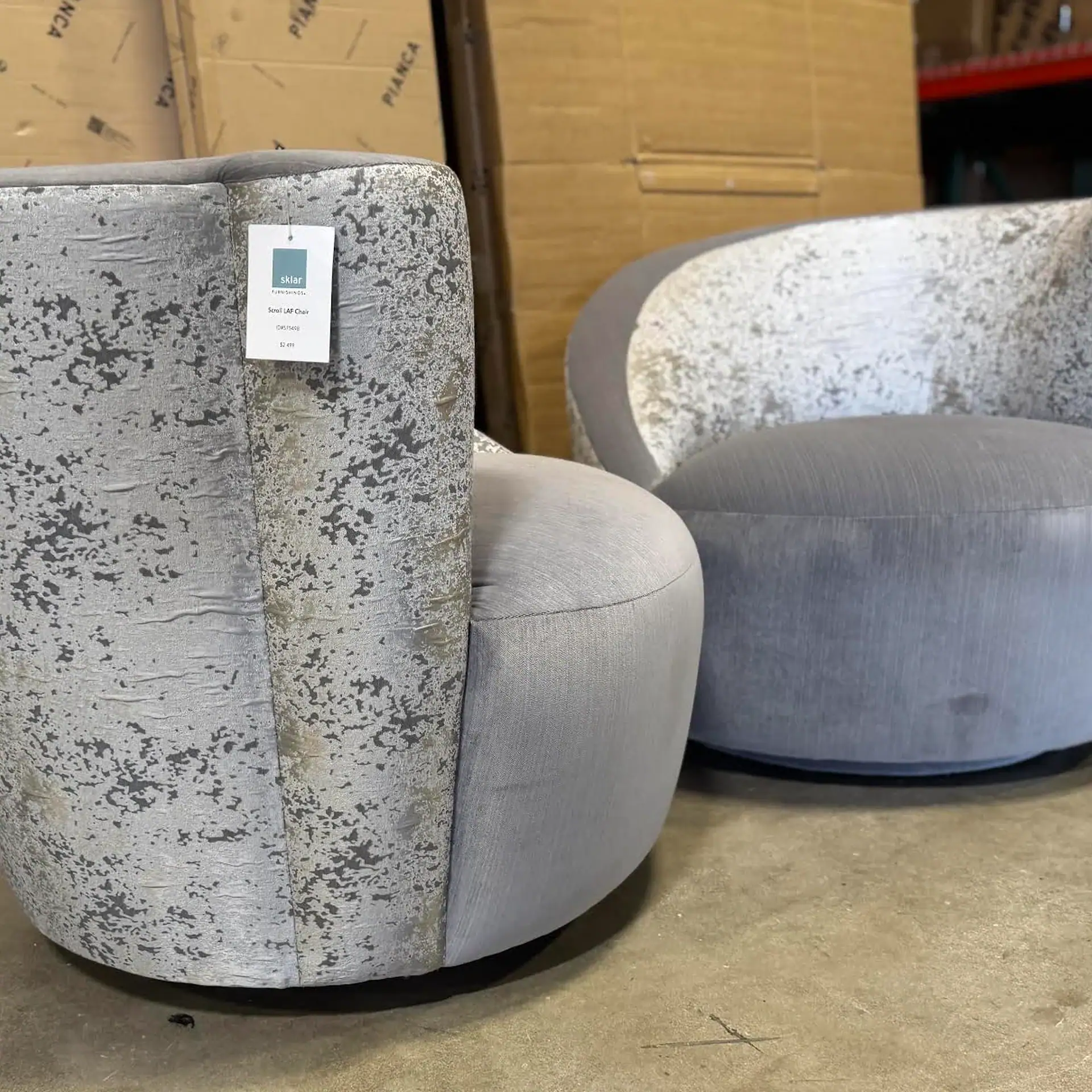 Lazar Scroll Swivel Chair set with textured fabric and rounded design.