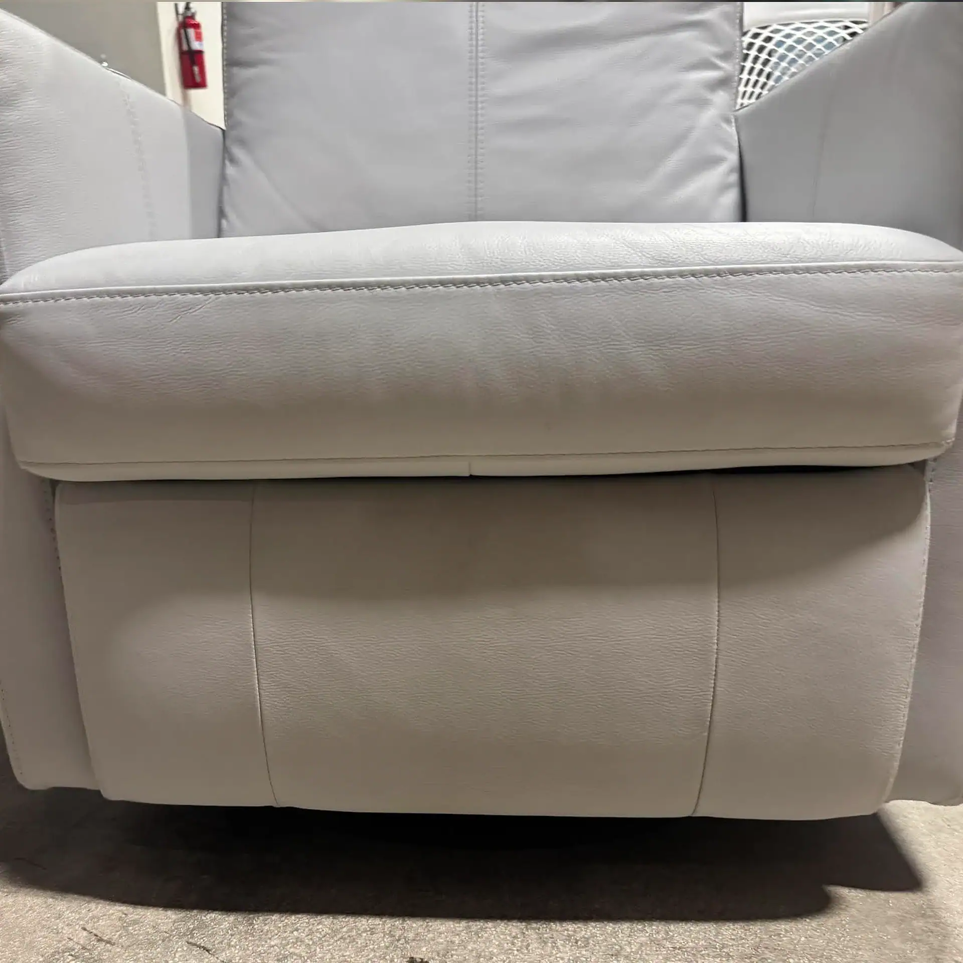 Luonto Track Power Recliner in light grey fabric.
