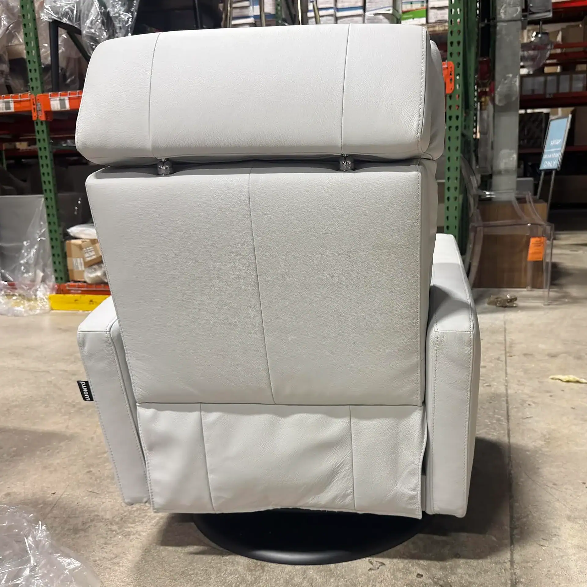 Luonto Track Power Recliner in warehouse setting.