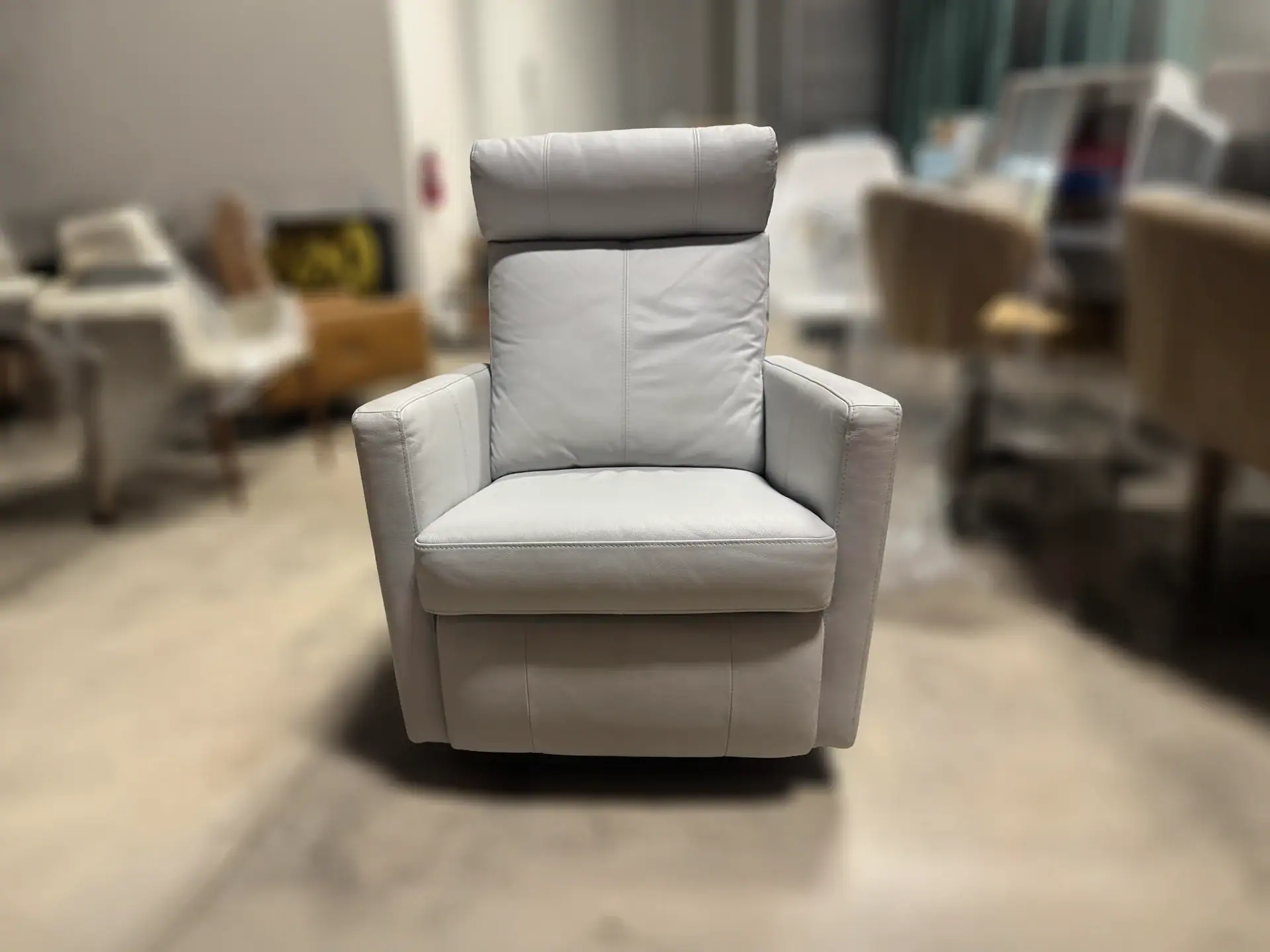 Luonto Track Power Recliner in a showroom setting.