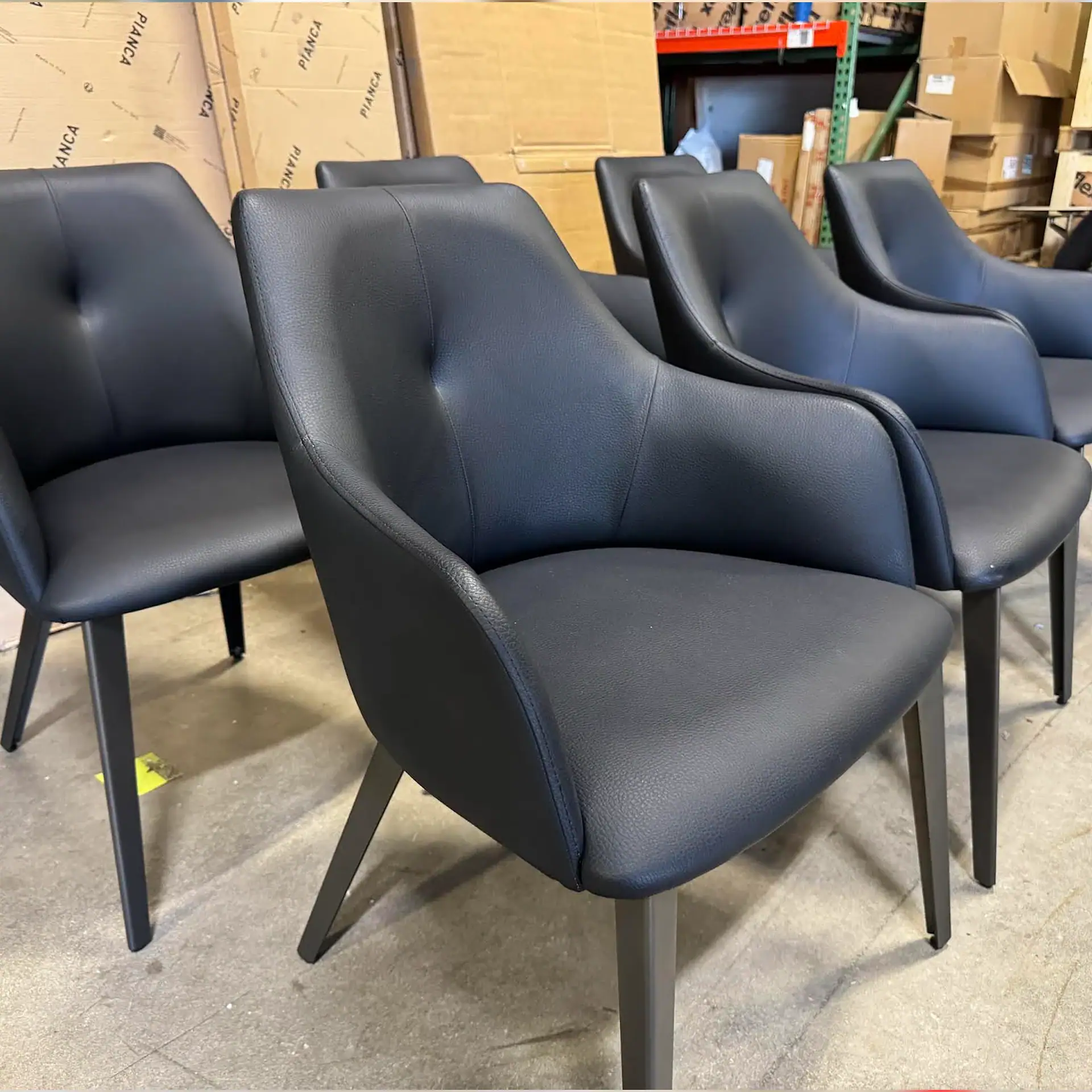 Sklar Furnishings Nuevo Renee dining chair in black with wooden legs.
