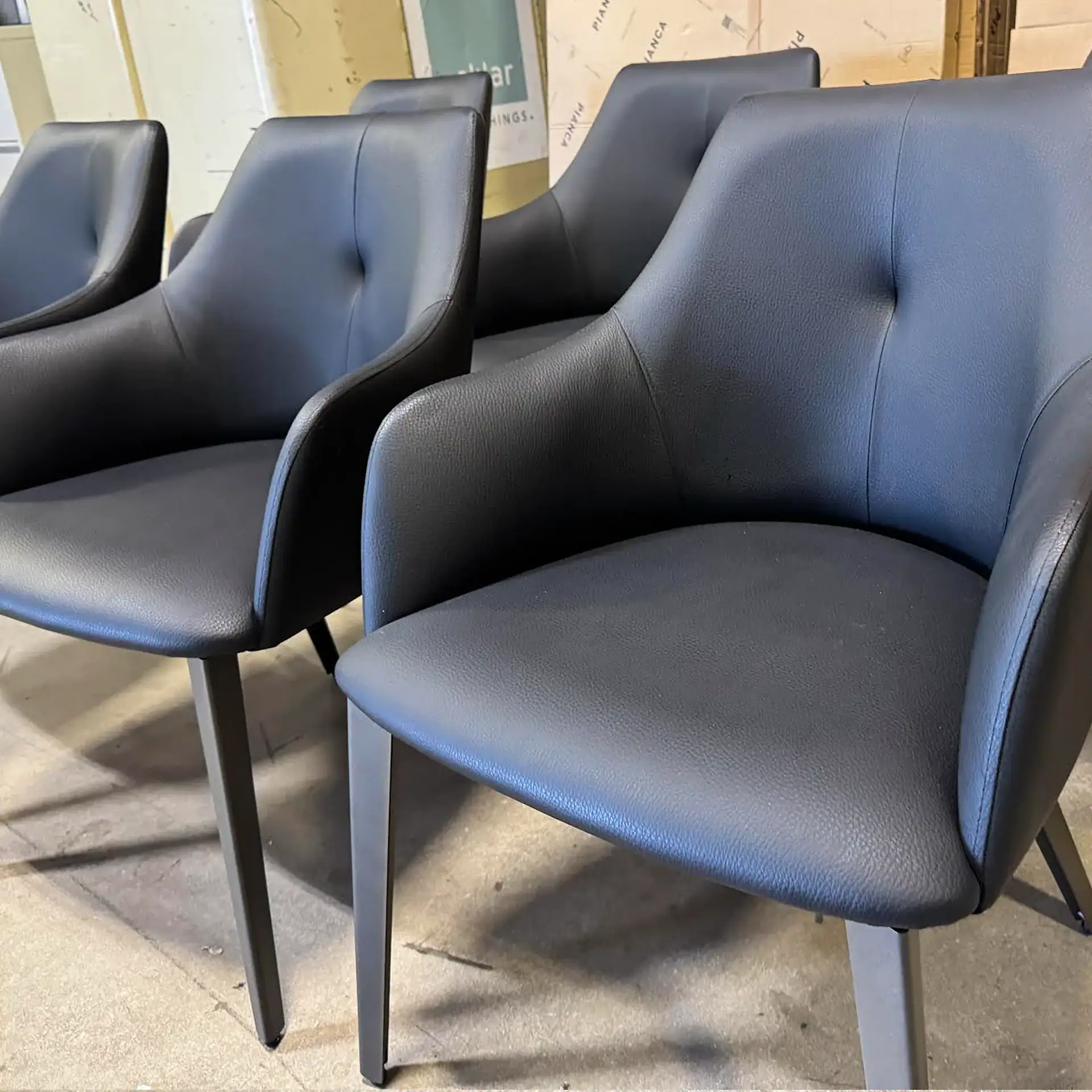 Sklar Furnishings Nuevo Renee dining chairs in dark blue fabric.