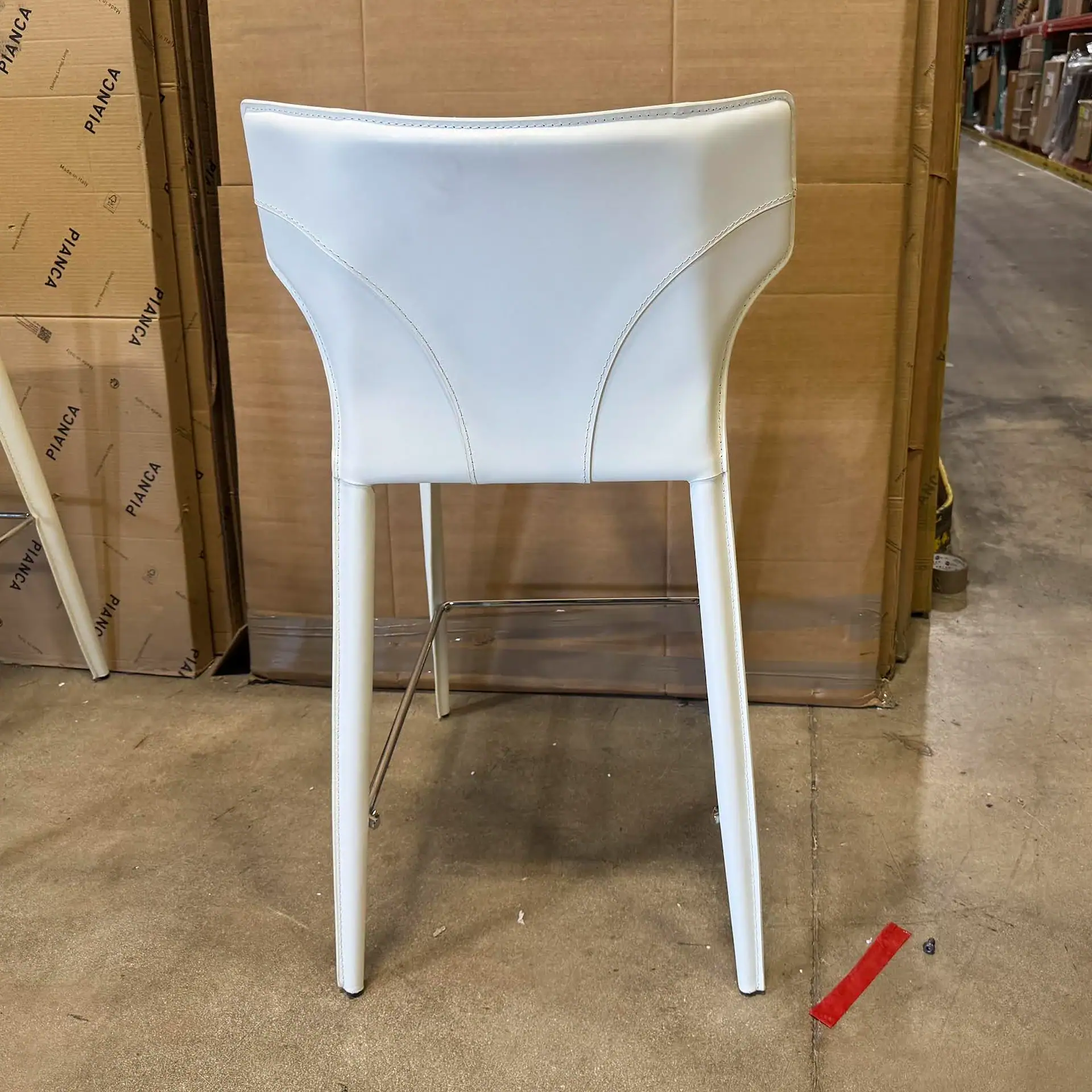 Sklar Furnishings Nuevo Wayne Bar Stool in white with metal legs.