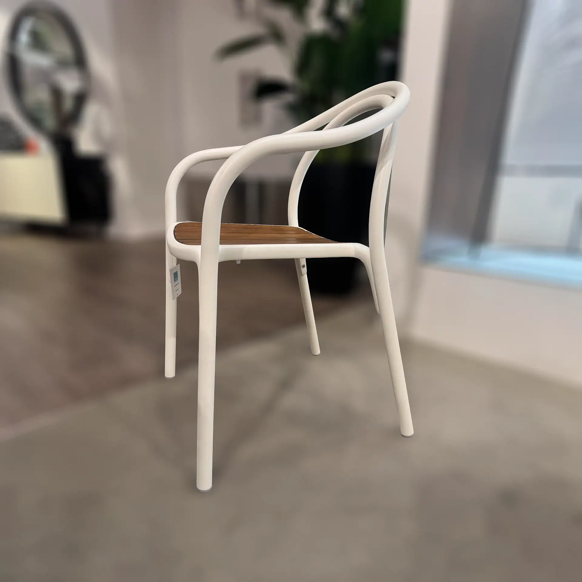 Pedrali 3746 Soul Armchair with white frame and wooden seat in a modern interior.