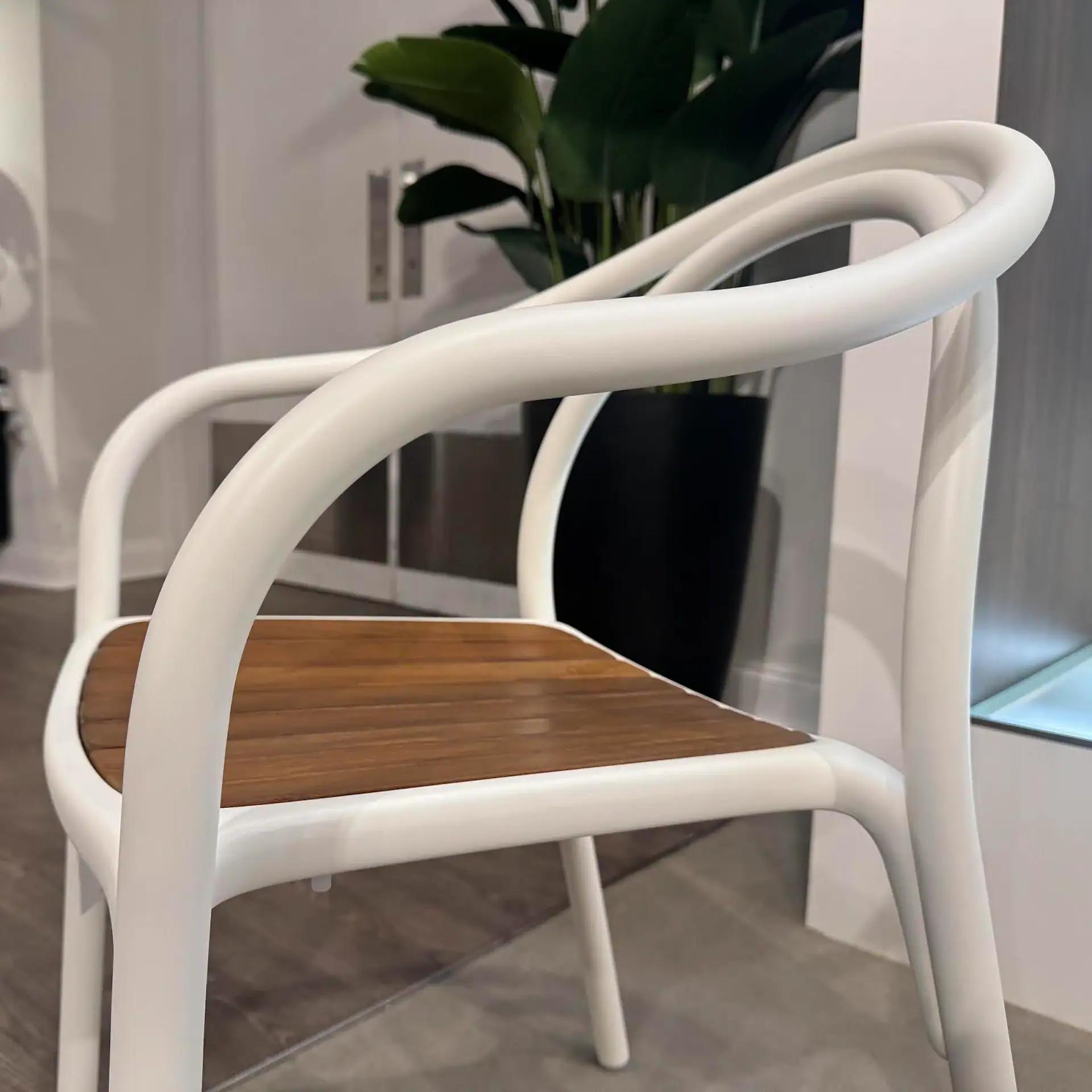 Pedrali 3746 Soul Armchair with wooden seat and white frame in modern interior.