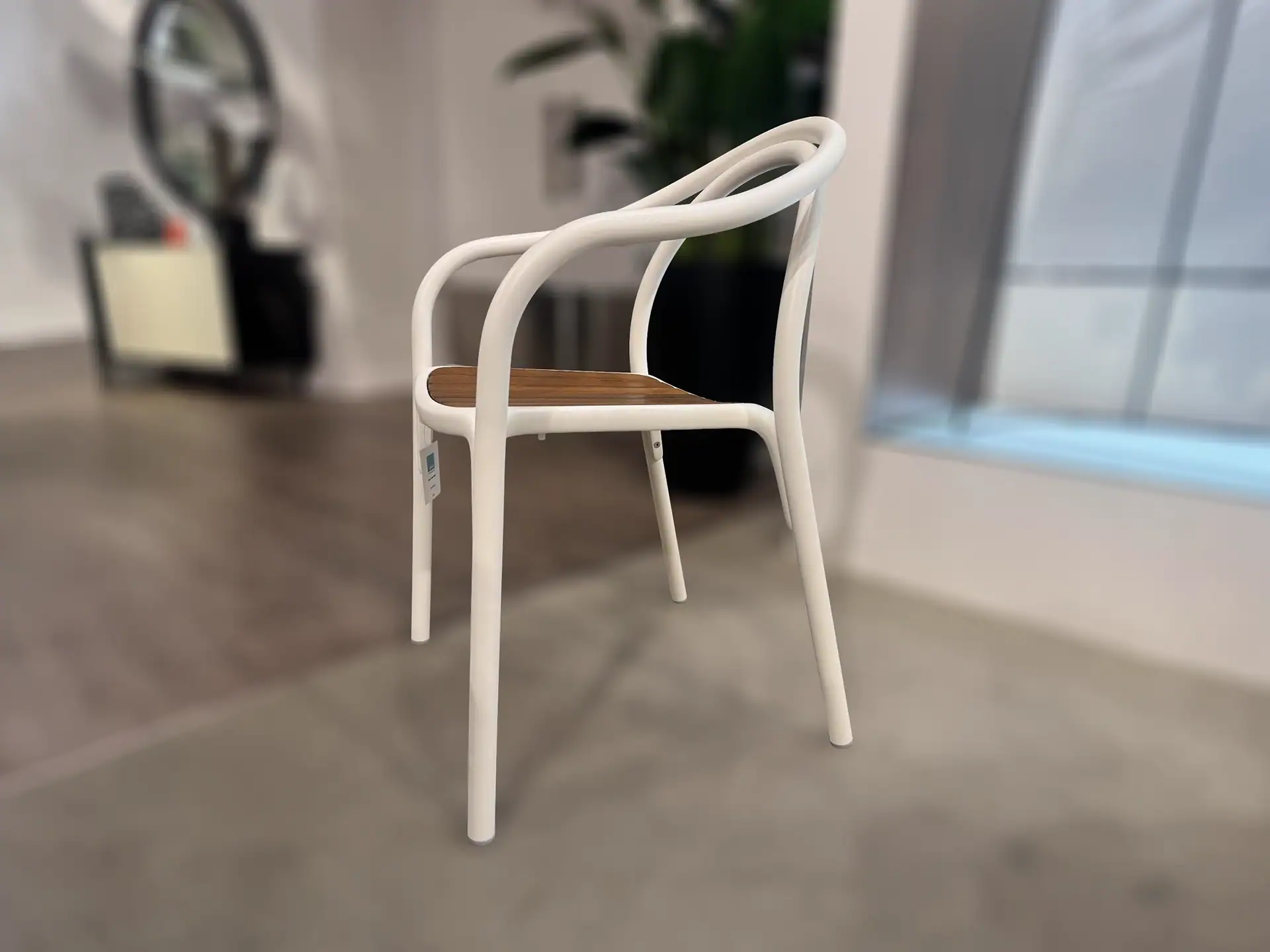 Pedrali 3746 Soul Armchair with wooden seat and white frame in a modern room.