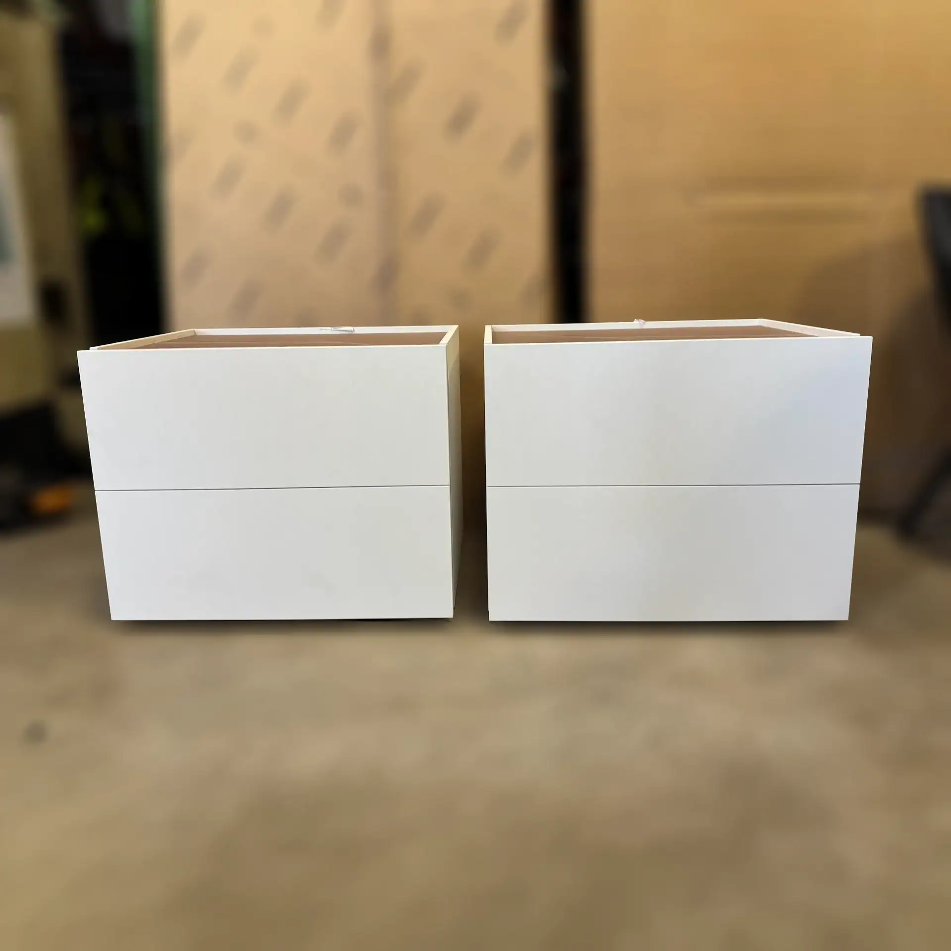 Pianca Atlante nightstands with clean white finish in a modern room.