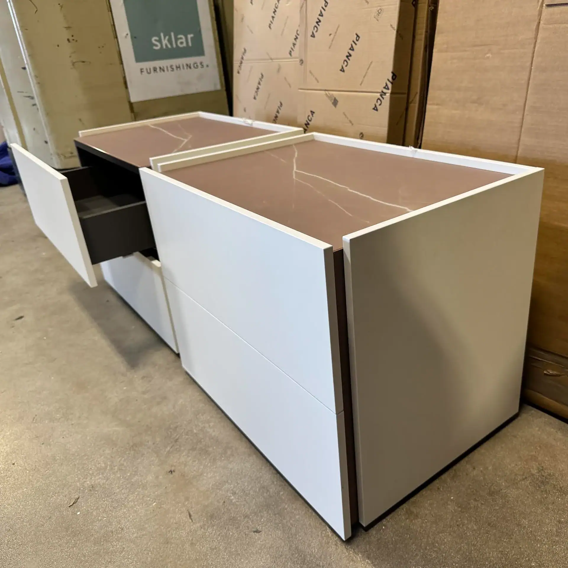 Pianca Atlante nightstand with open drawer in room setting.