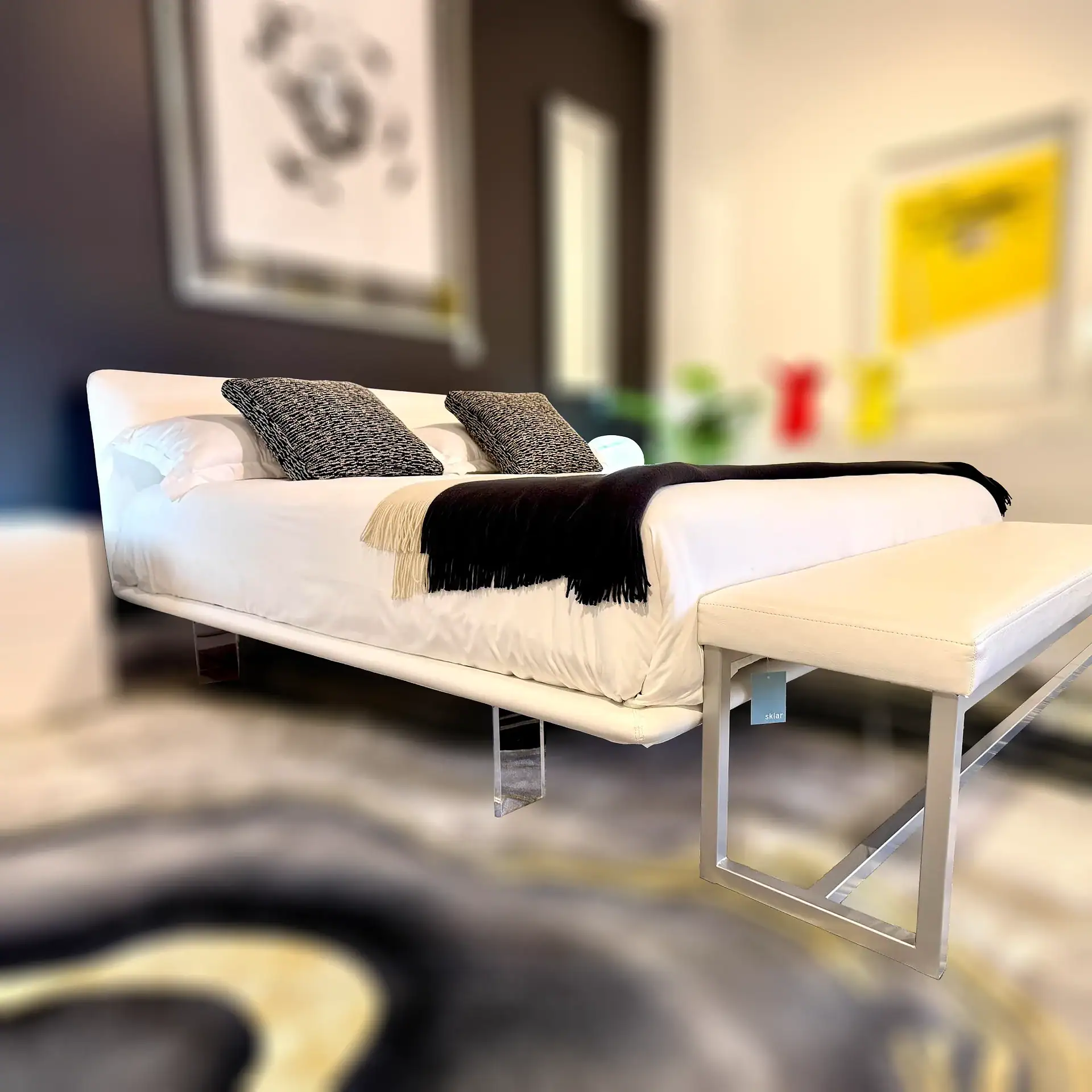Modern Pianca Filo Up Queen Bed with black and white bedding and decorative pillows.