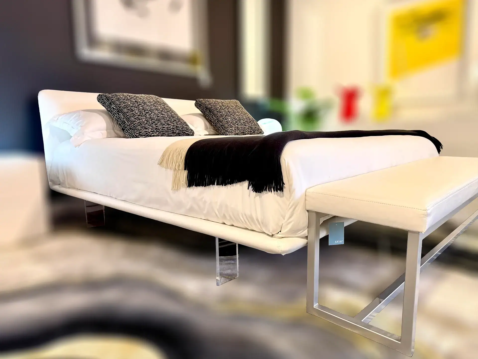 Modern Pianca Filo Up Queen Bed with black and gray pillows in a stylish bedroom.