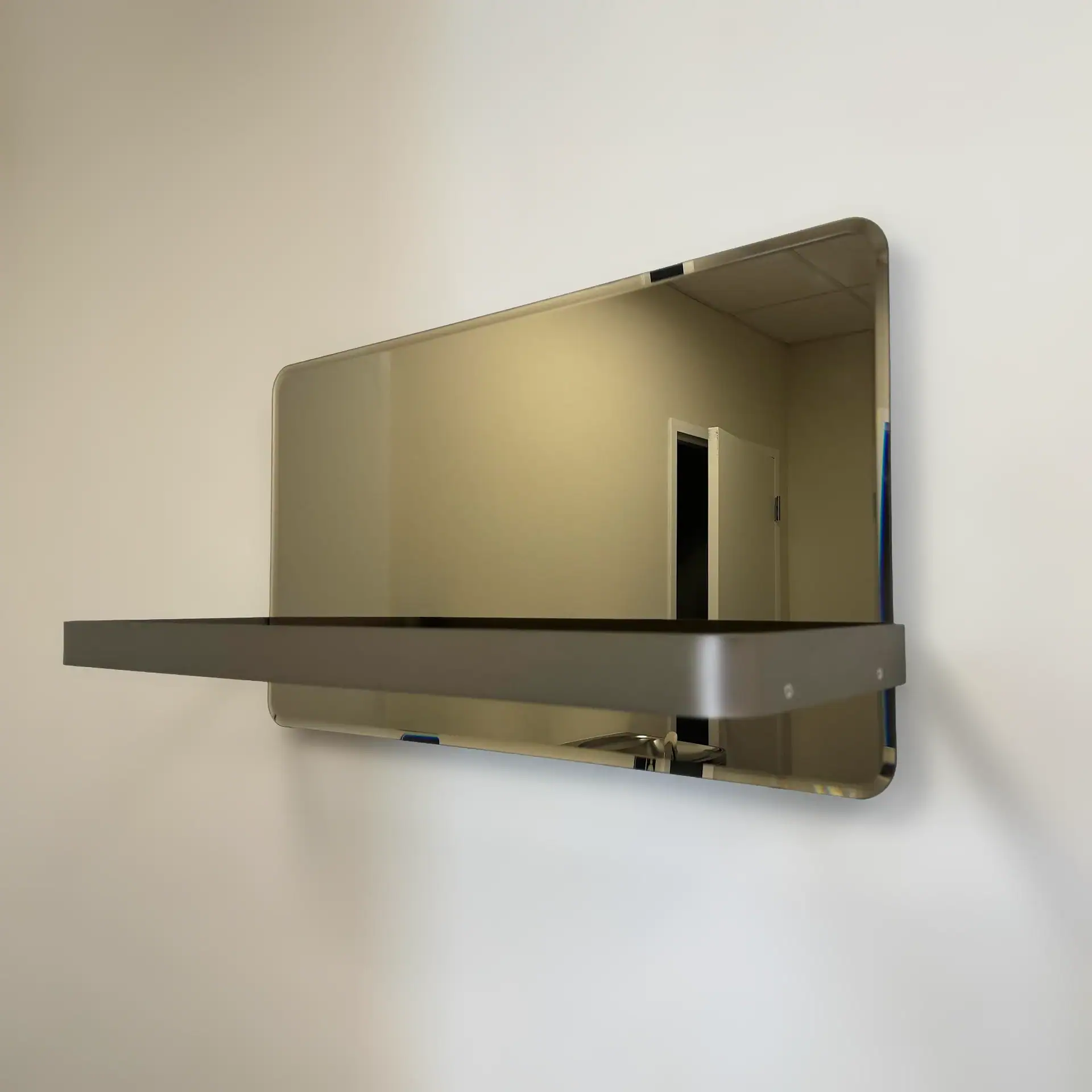Reflex Shelf Mirror by Sklar Furnishings on a wall.