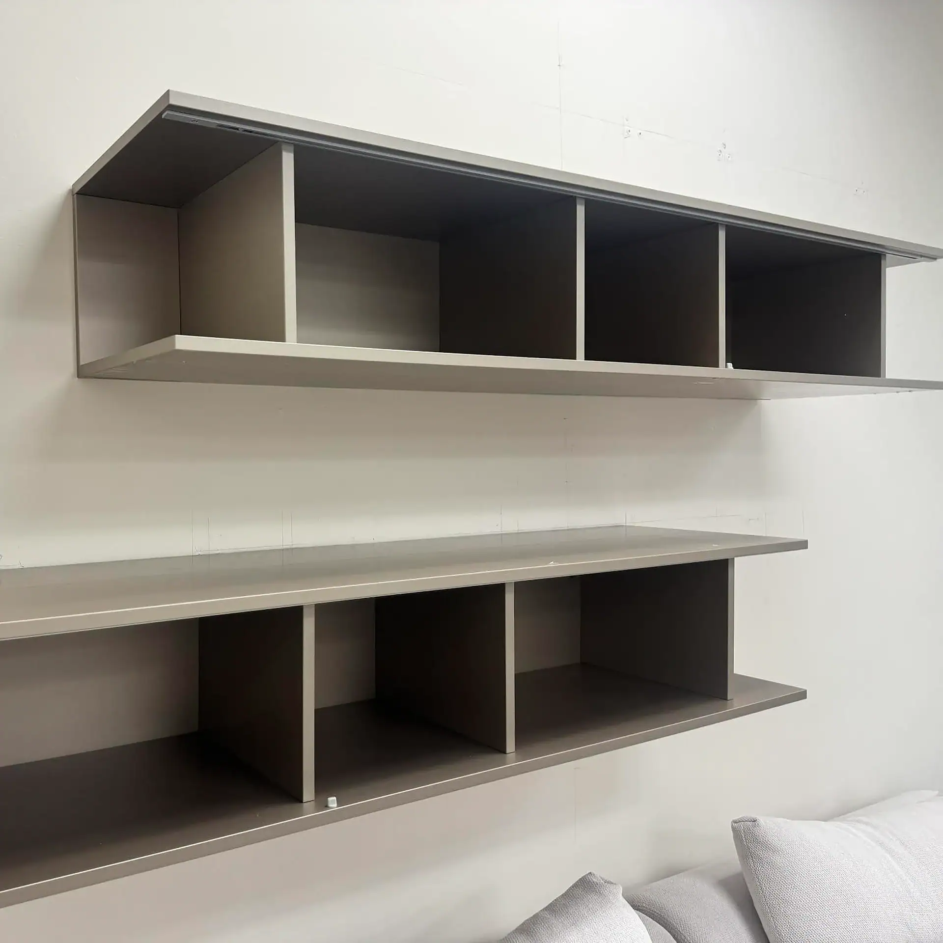 Sklar Furnishings San Giacomo Alias hanging bookcase on wall.