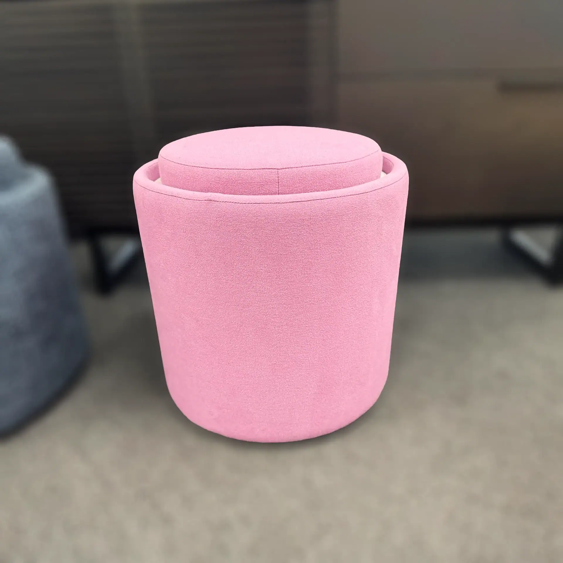 Pink Pill Top Pouf Table by Sklar Furnishings in a room setting.