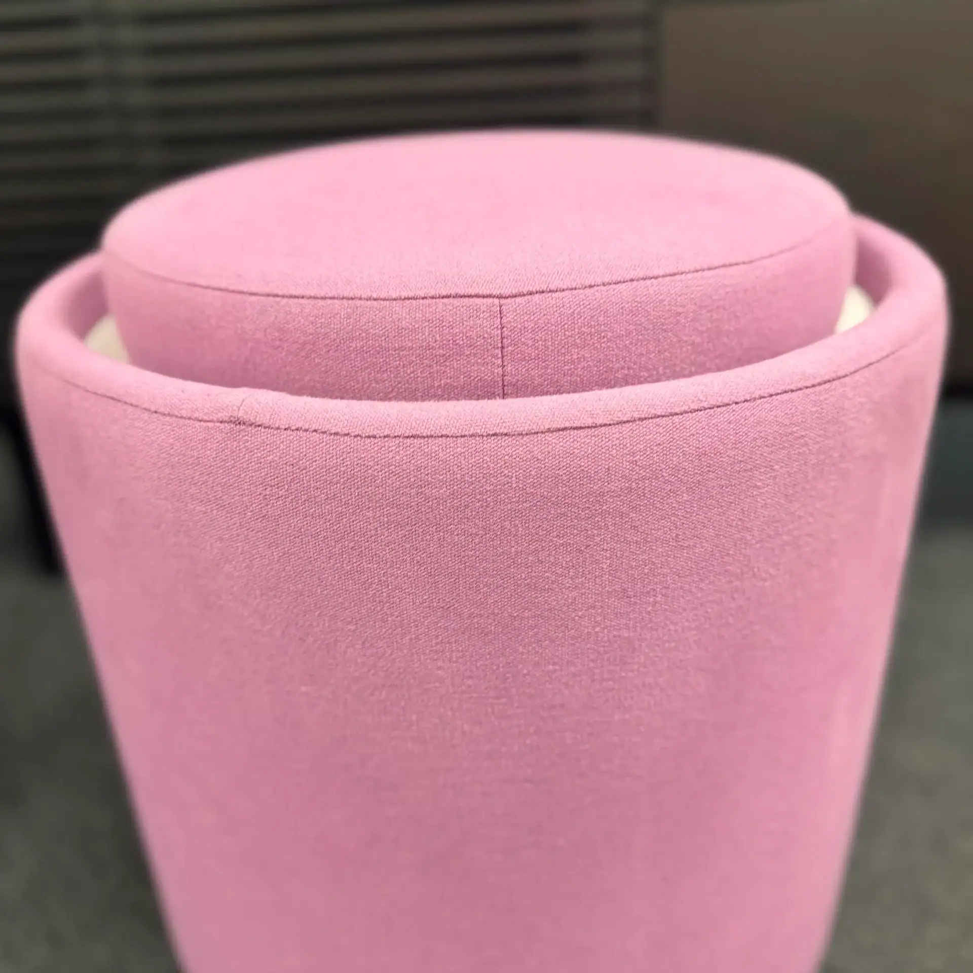 Sklar Furnishings Pill Top Pouf Table in pink fabric.