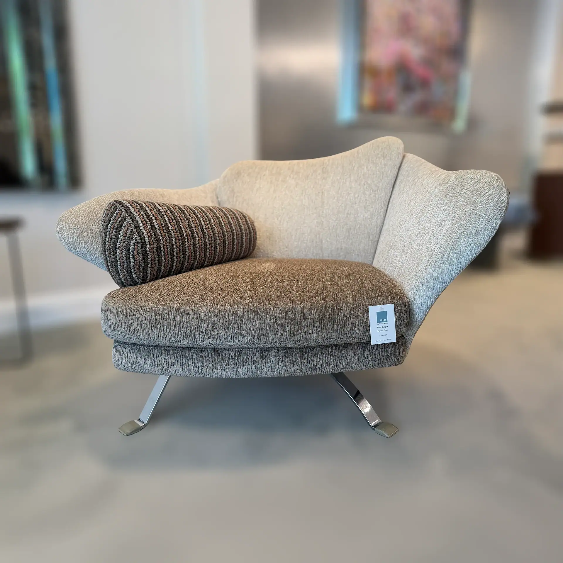Sklar Furnishings Flower Armchair with cushion in a showroom setting.