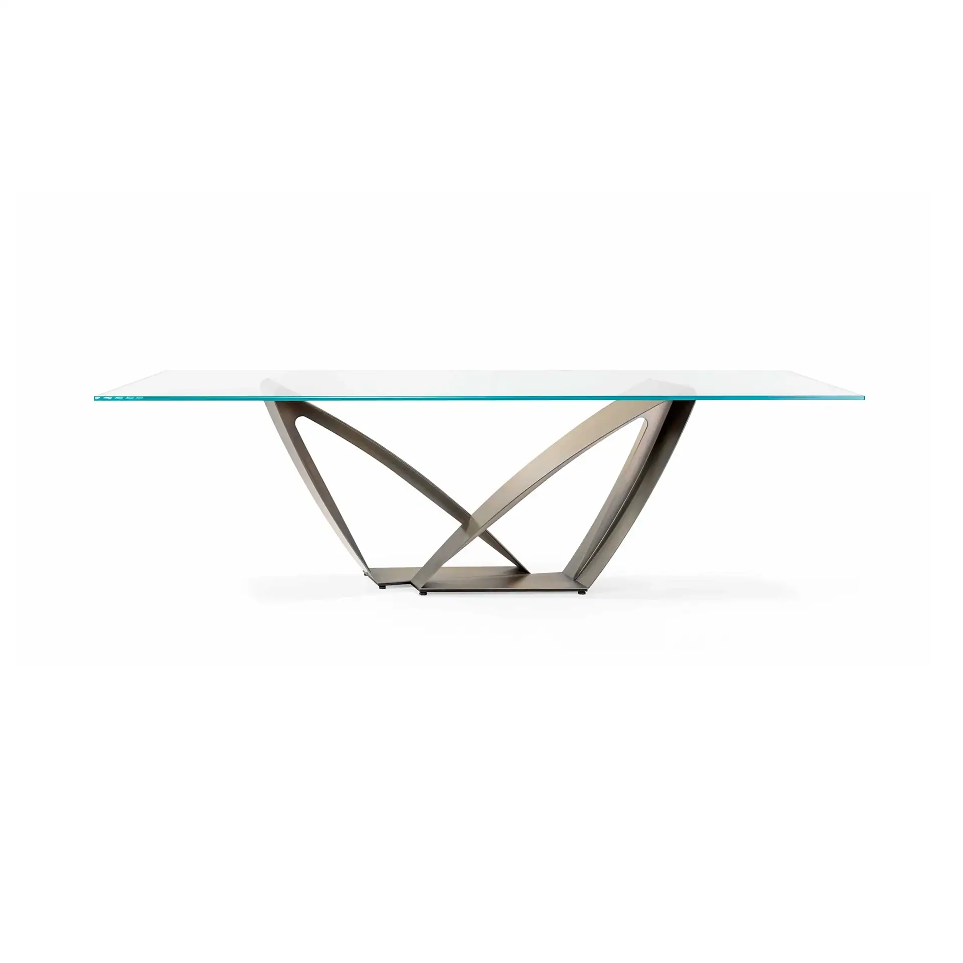 A modern dining table with a rectangular glass top and a sculptural, geometric dark metal base on a white background.