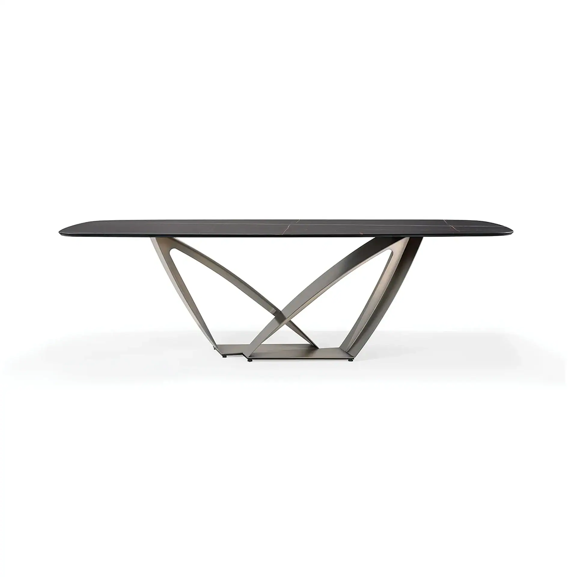 A modern dining table with a dark, rectangular top and a sculptural, intersecting brushed metal base, set against a white background.