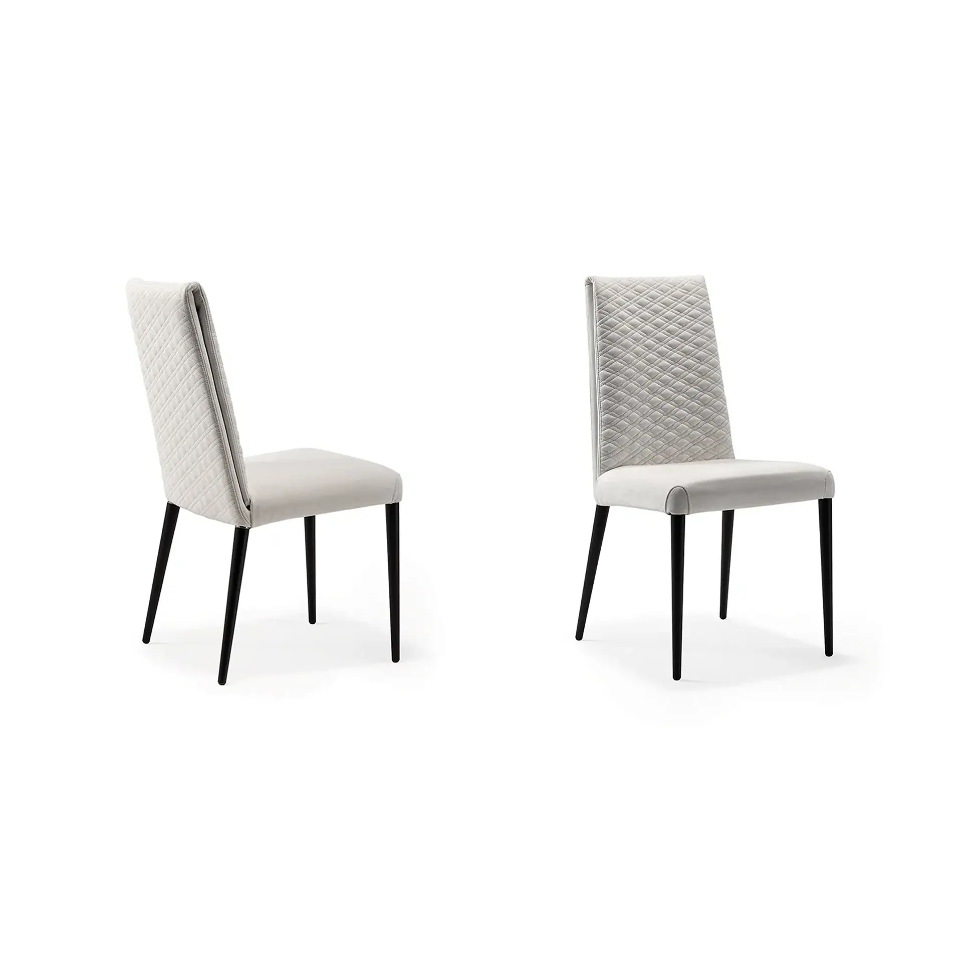 Two light gray dining chairs with quilted backrests and black legs on a white background.