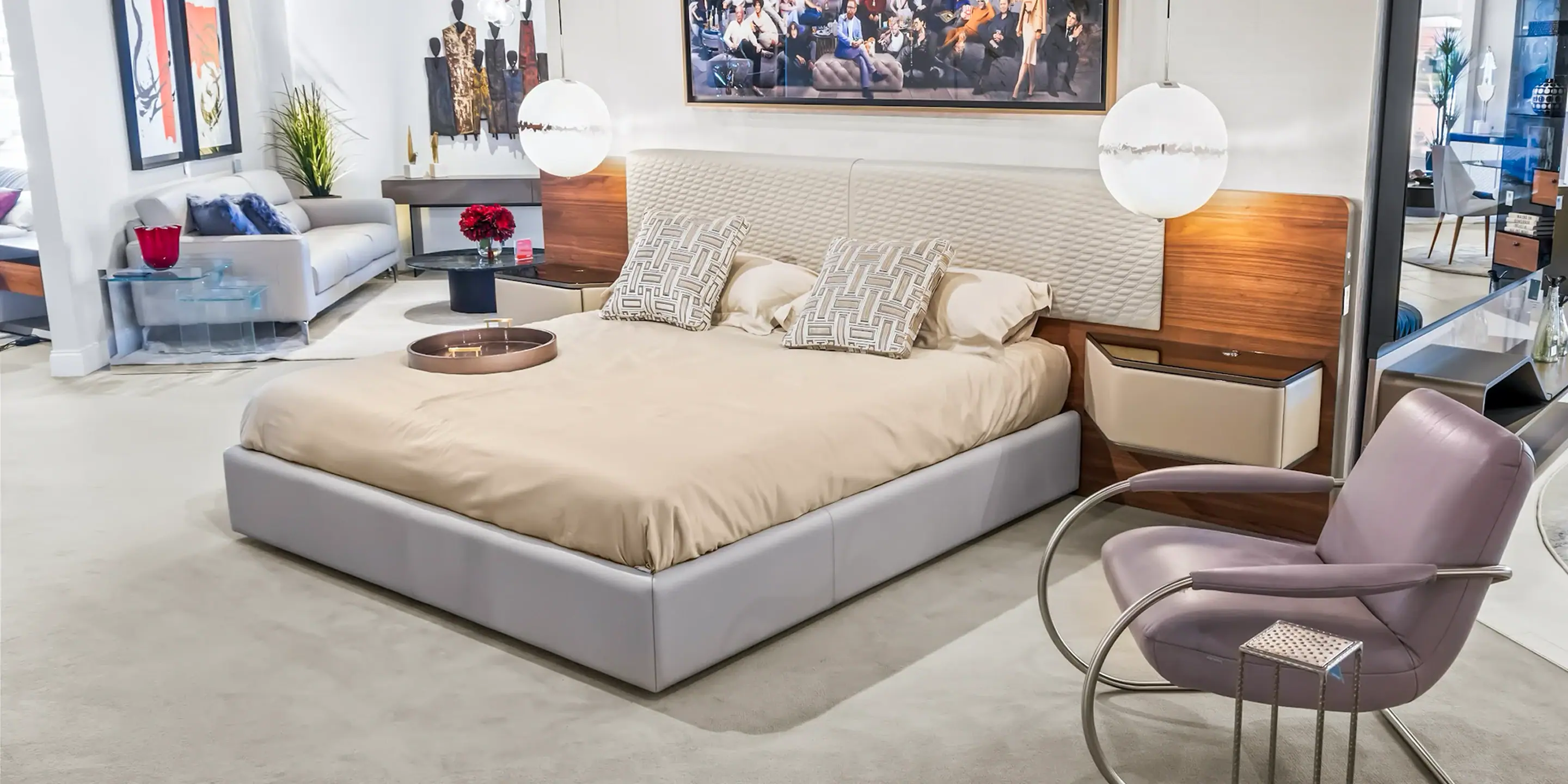 showroom-vignette-jun-26-bedroom Sklar Furnishings bed with two nightstands and lamps in a showroom.