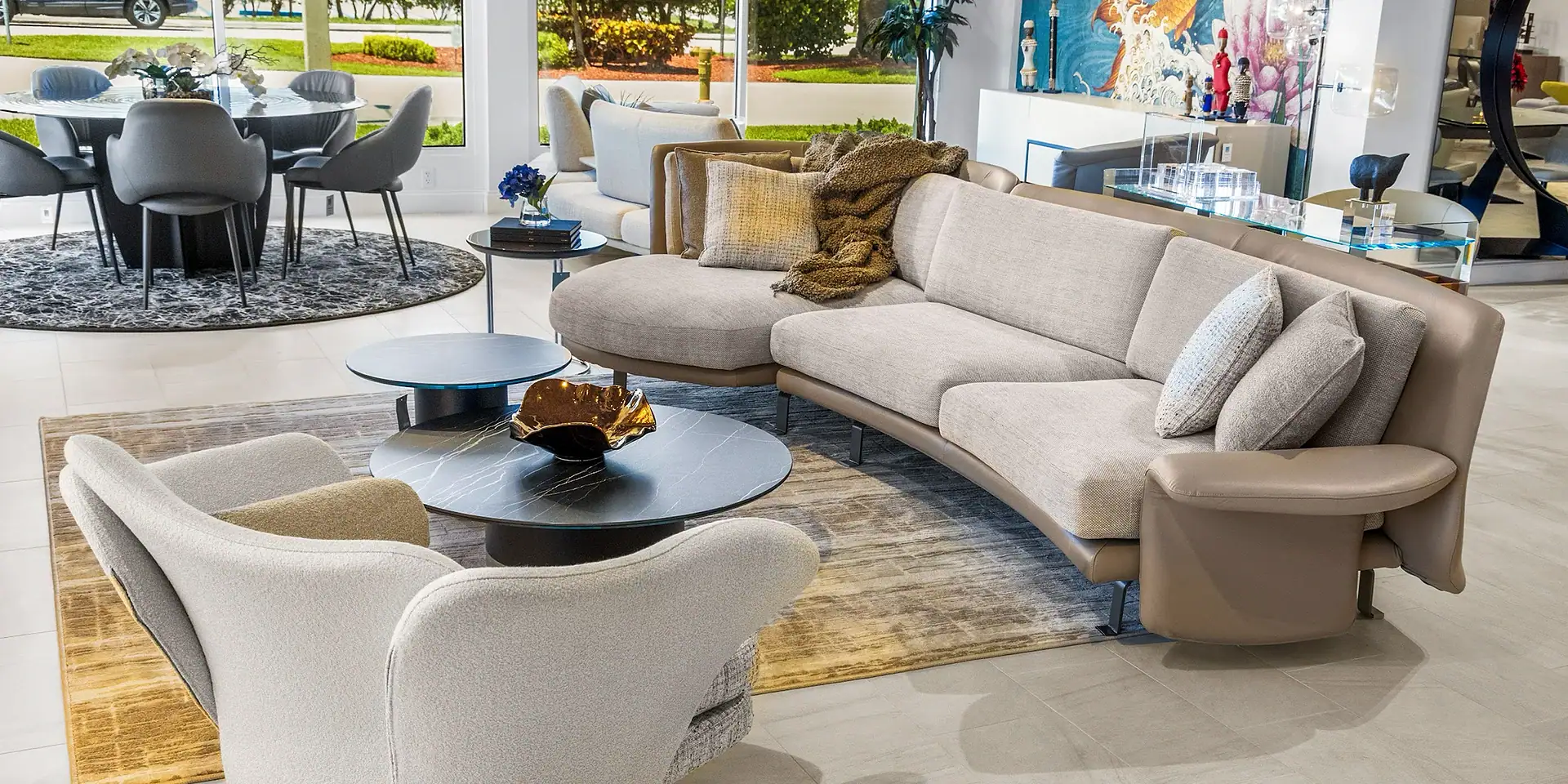 Sklar Furnishings sofa in a modern living room with large windows and artwork.