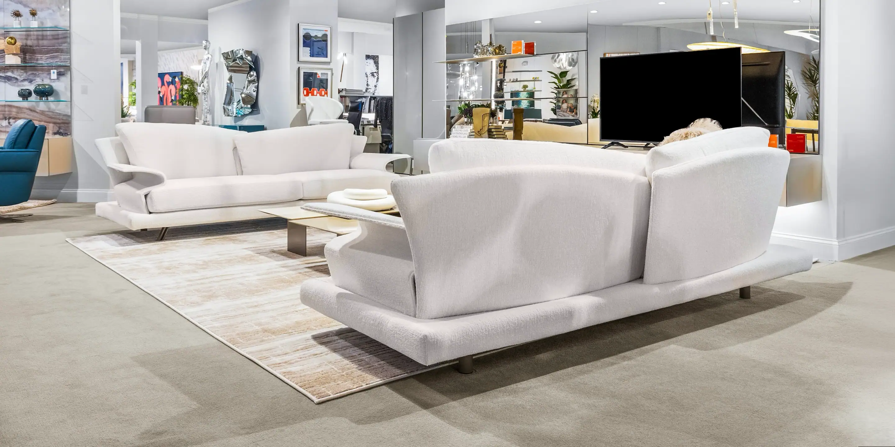 Modern White Sofa Set Modern white sofa set in a spacious living room with contemporary decor.
