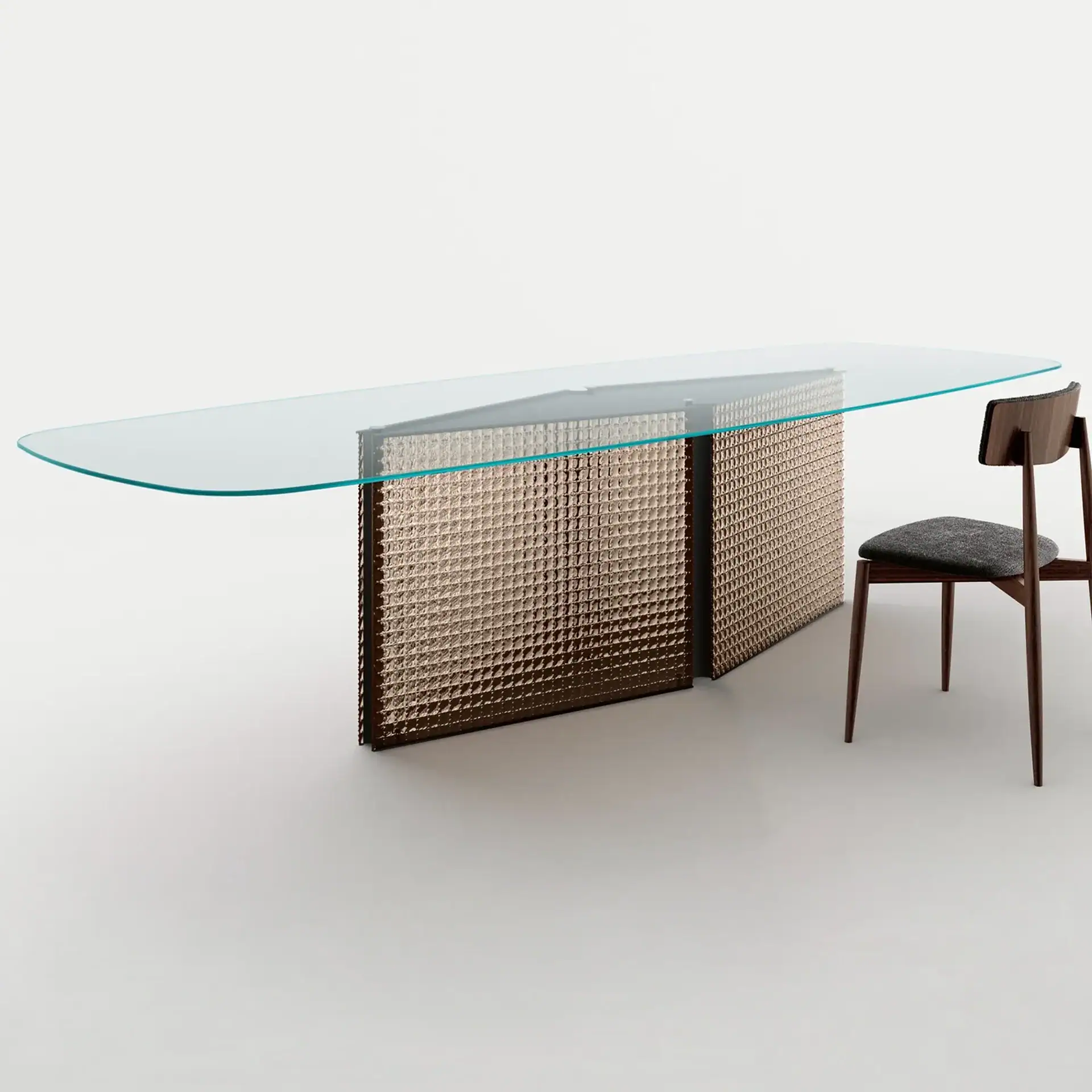 Sklar Furnishings glass dining table with textured base and wooden chair.