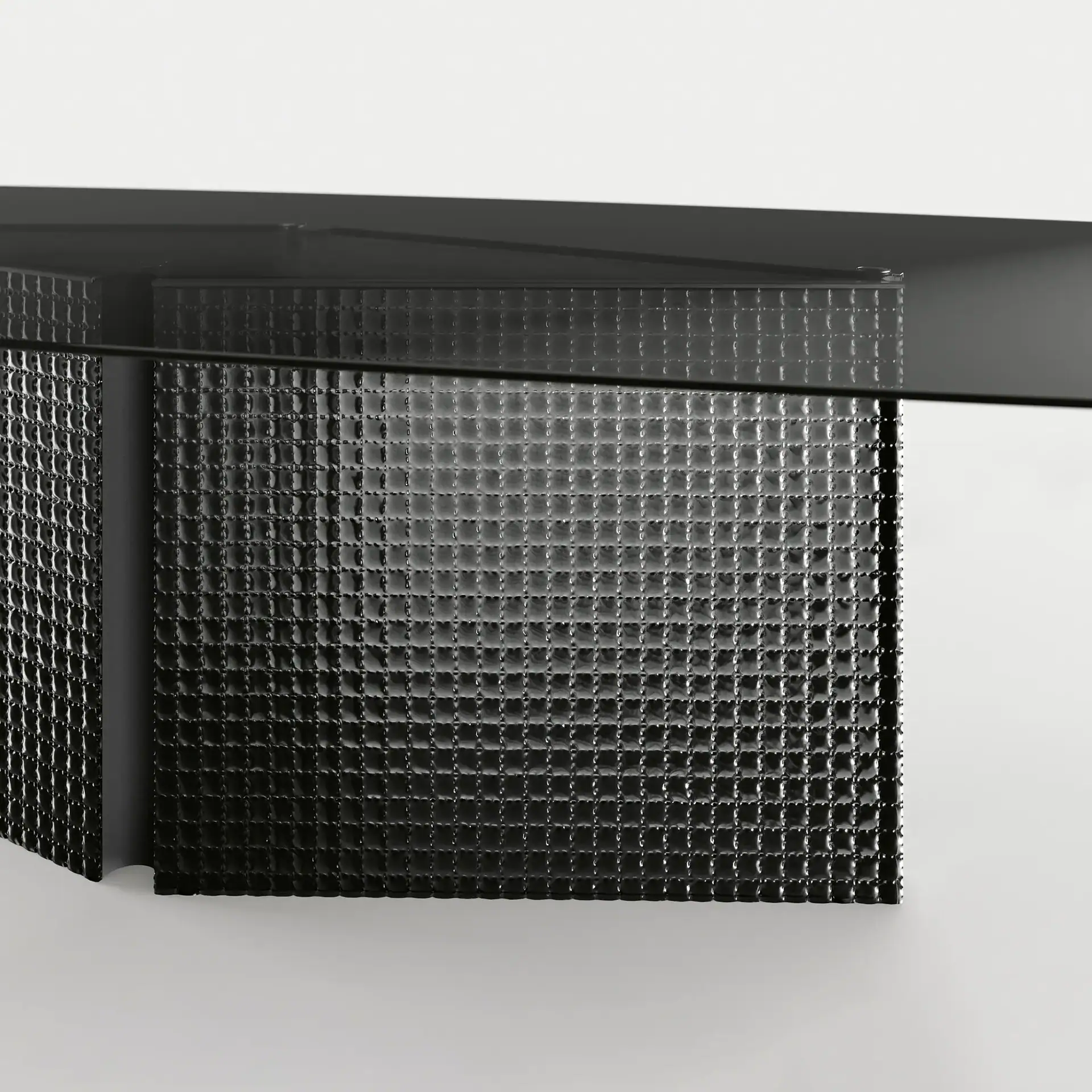 Sklar Furnishings black coffee table with textured surface in modern room.