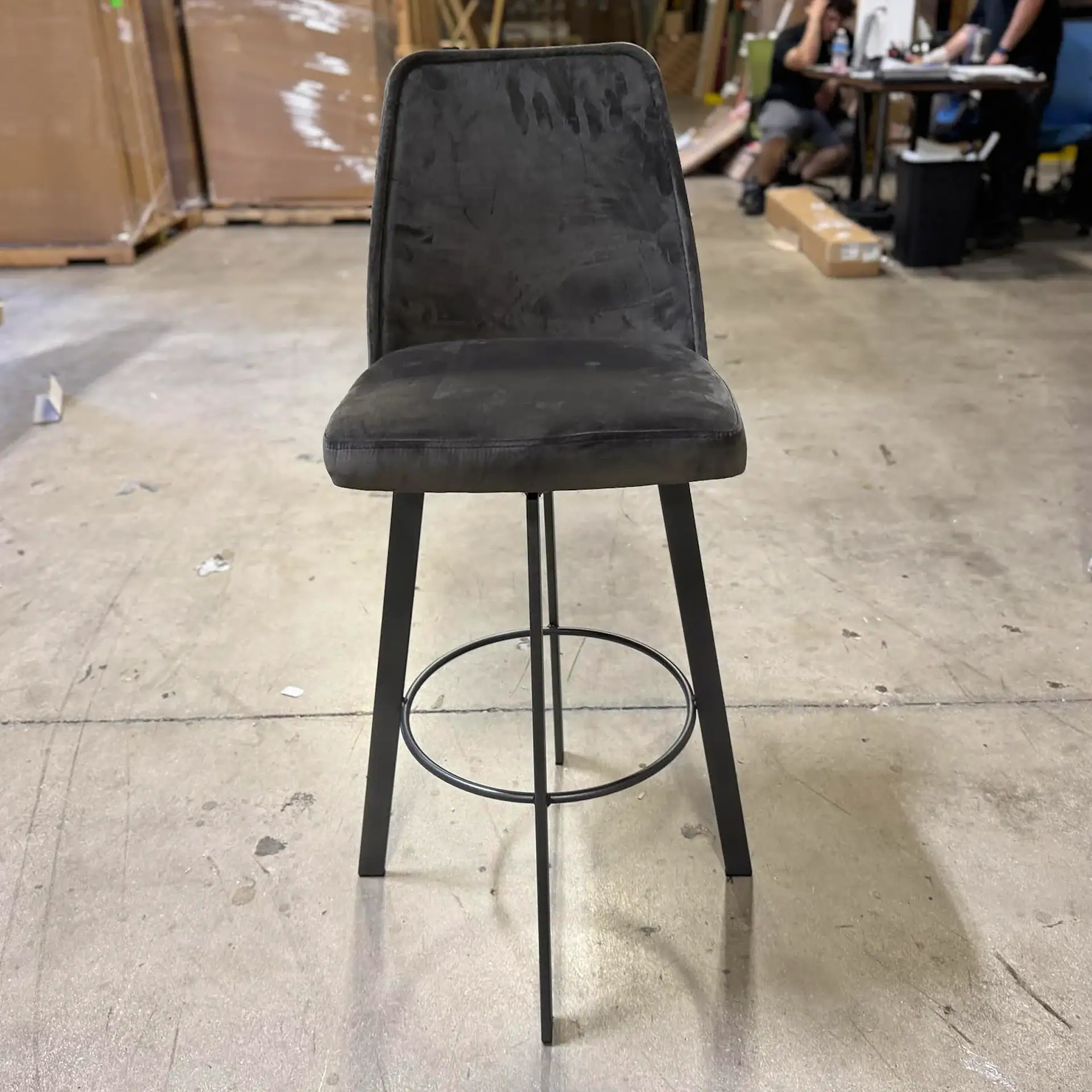 Sklar Furnishings bar stool with black upholstery and metal legs.