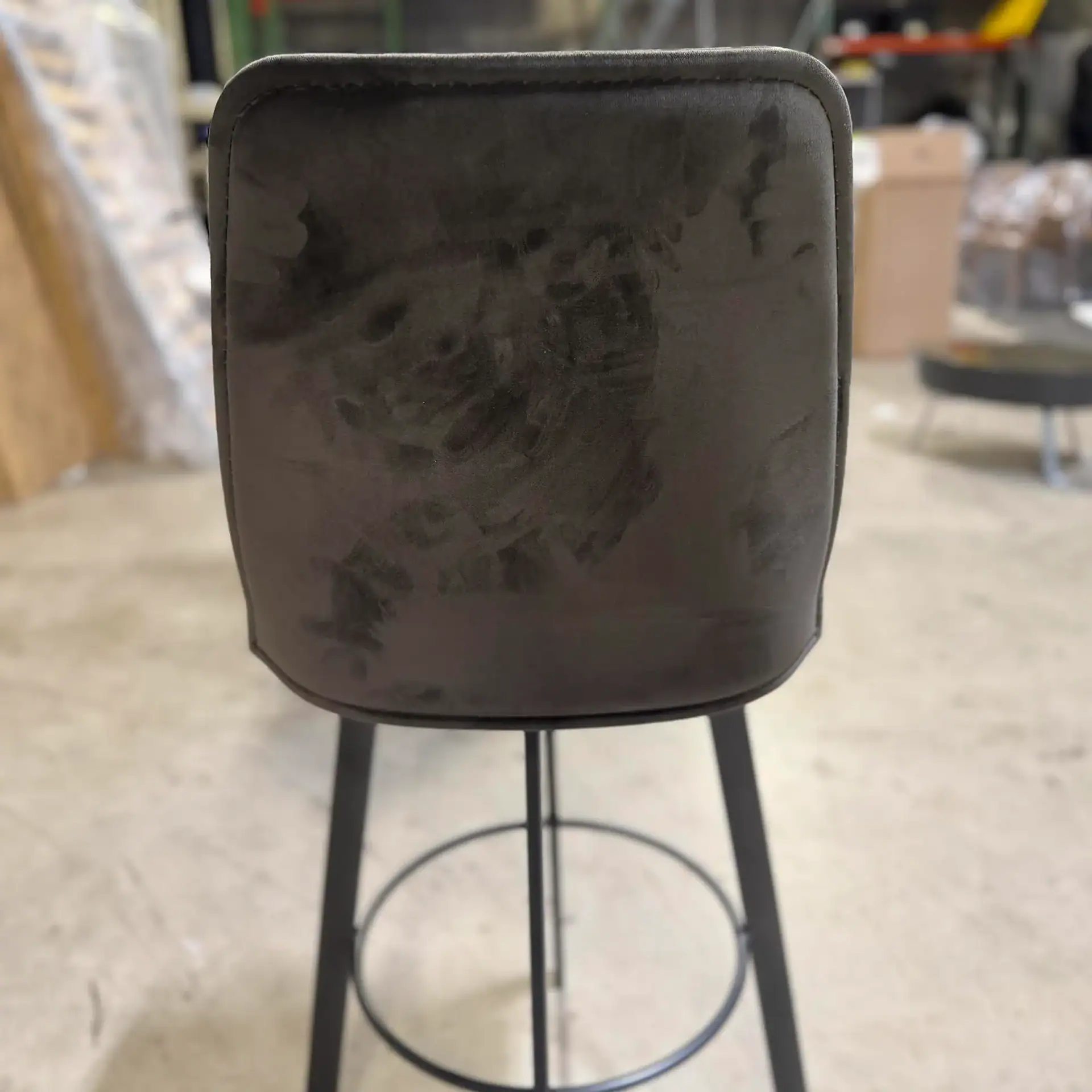Sklar Furnishings bar stool with black velvet upholstery and metal legs.