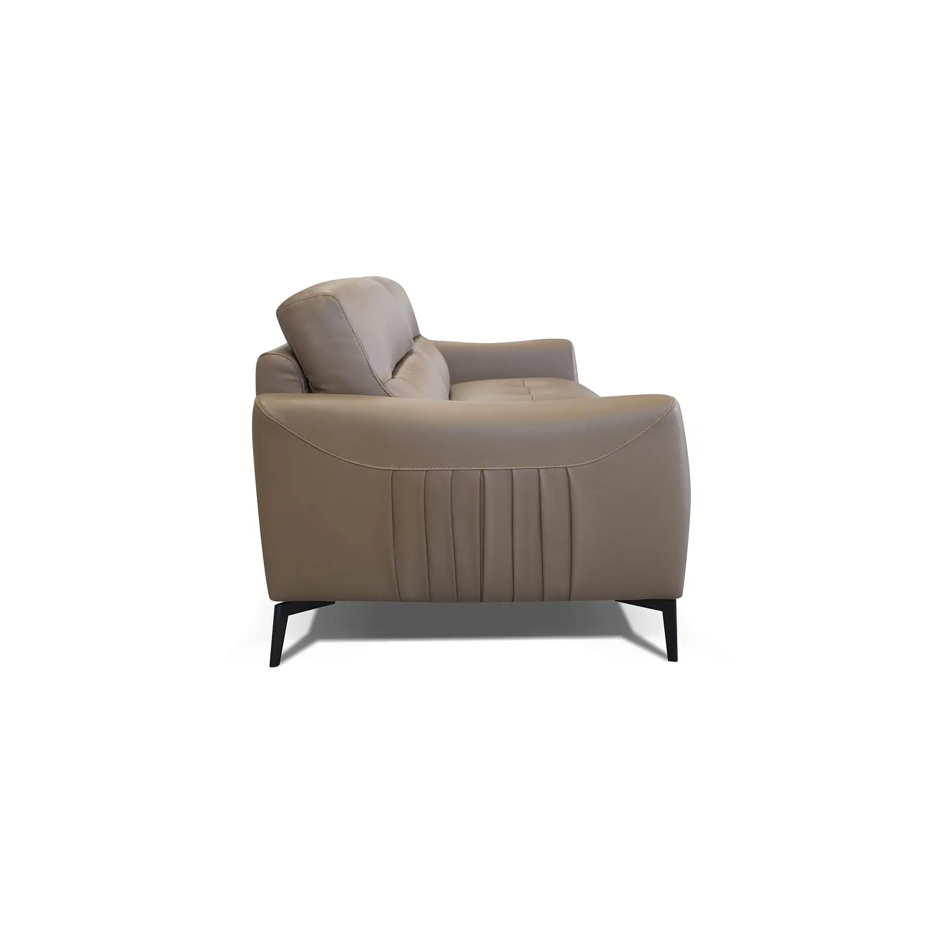Side view of a light beige modern sofa with pleated armrests and dark angular legs on a white background.