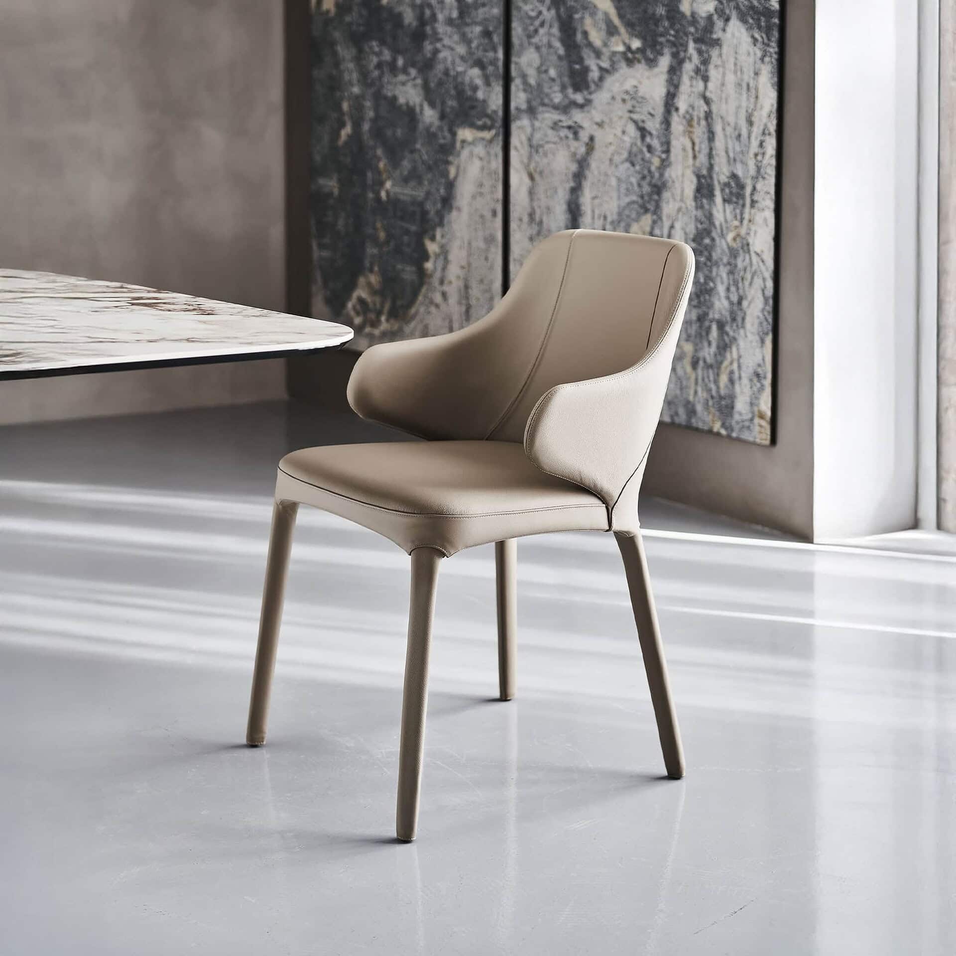 Modern beige lounge chair in a contemporary room setting.