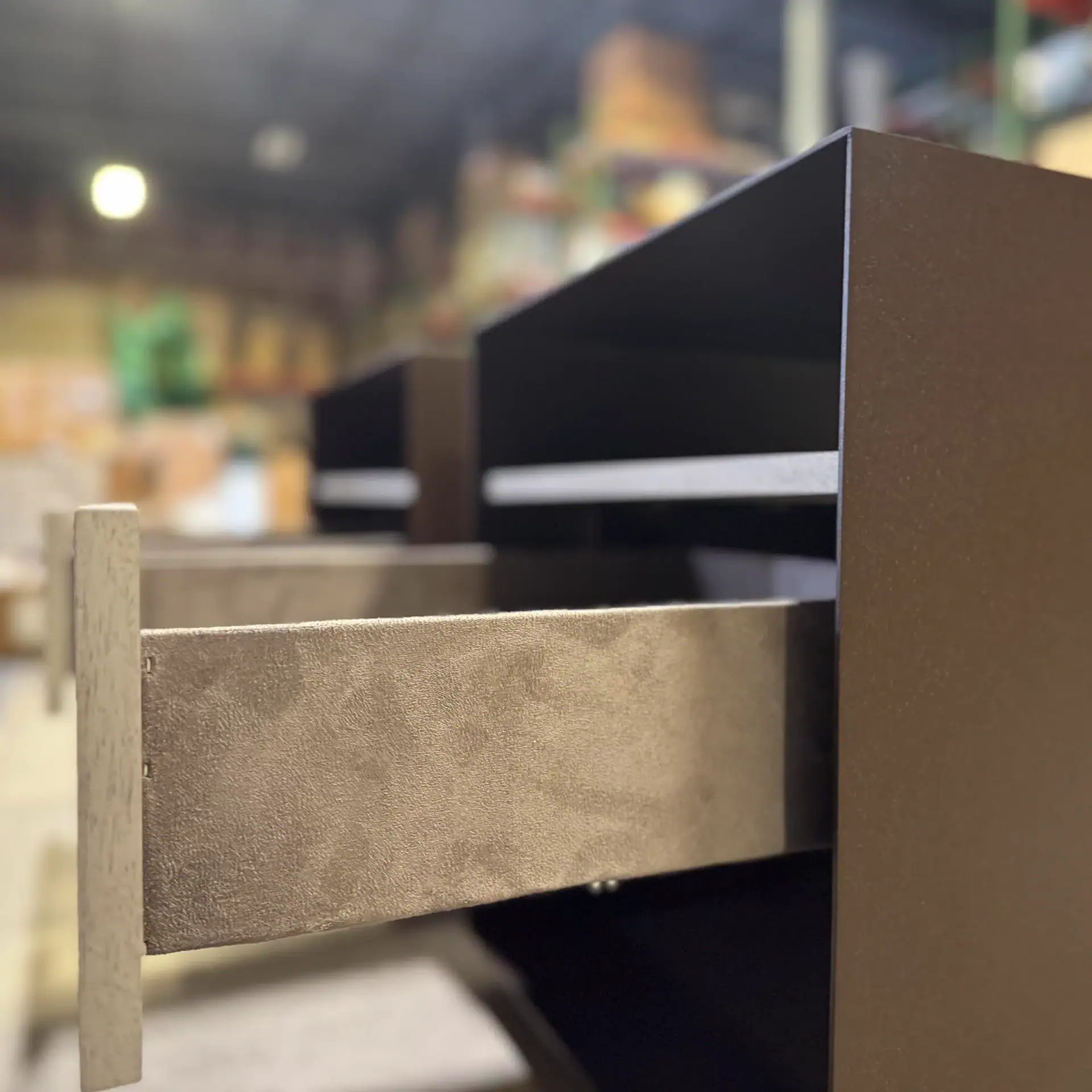 Close-up of a nightstand drawer in a furniture store.