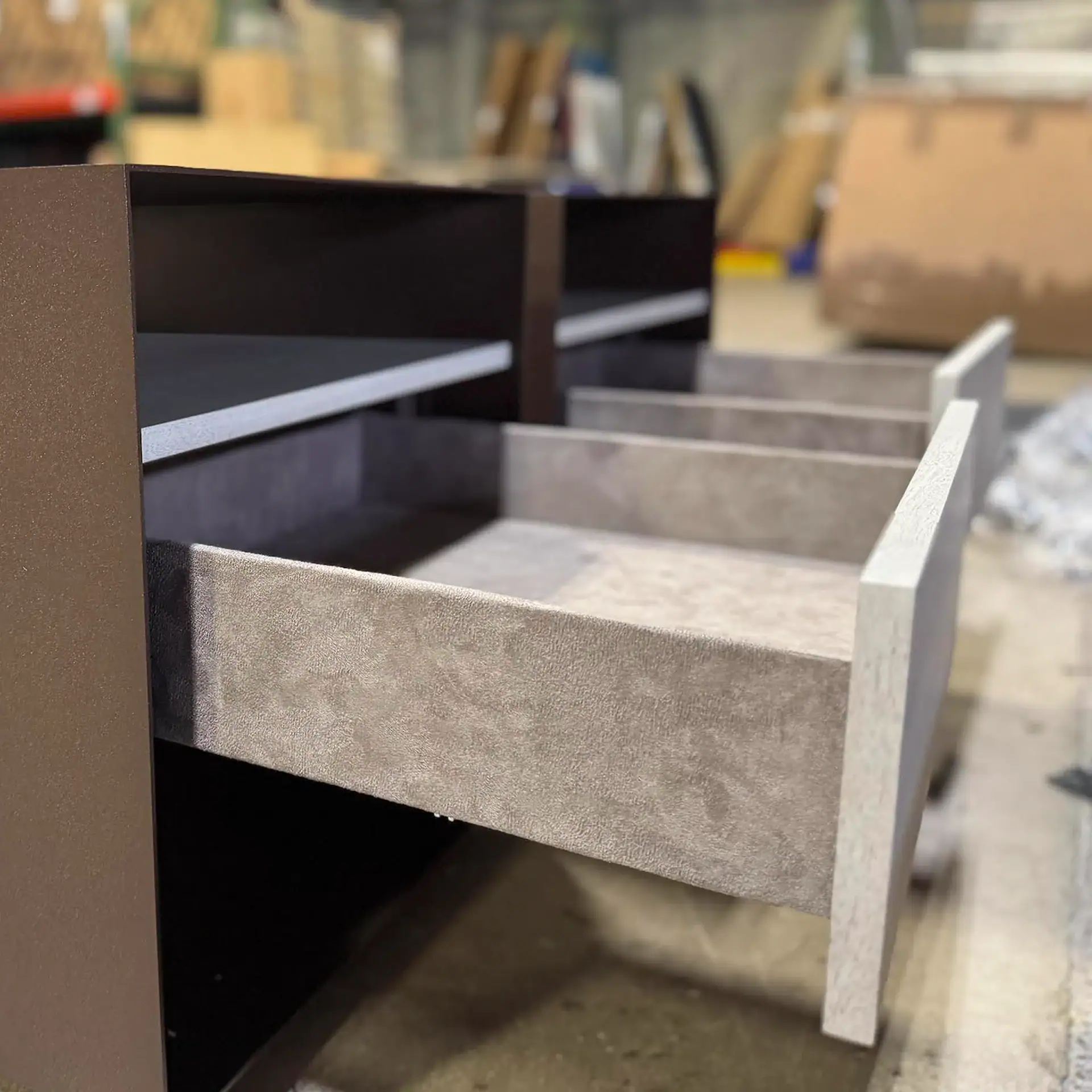 Close-up of a drawer for Trica Boulevard nightstand in a workshop.