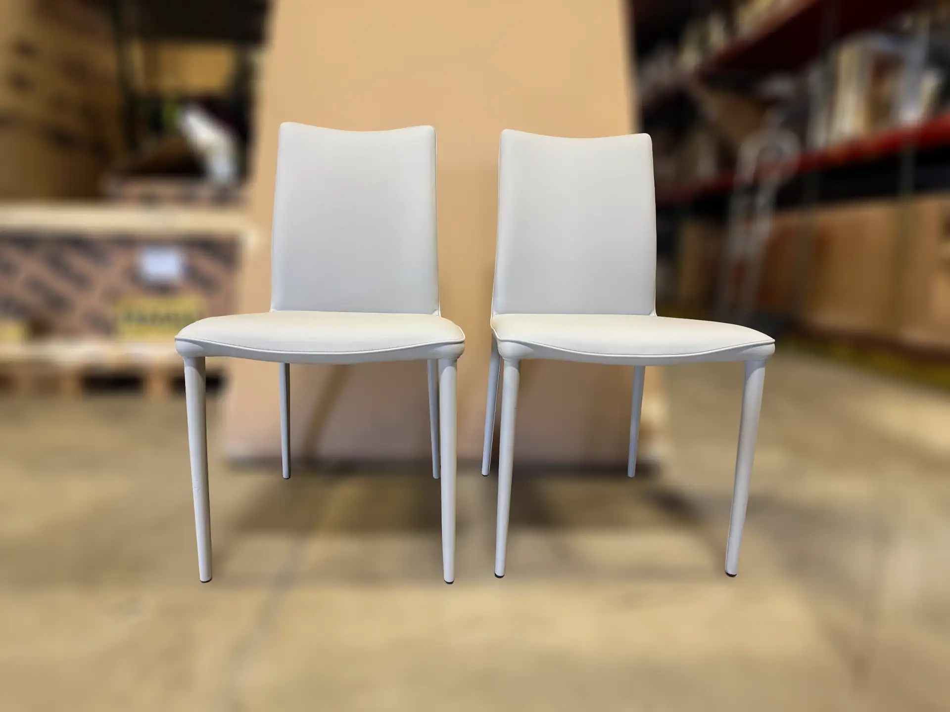 Shefi Quilted Dining Chair pair in a showroom setting.