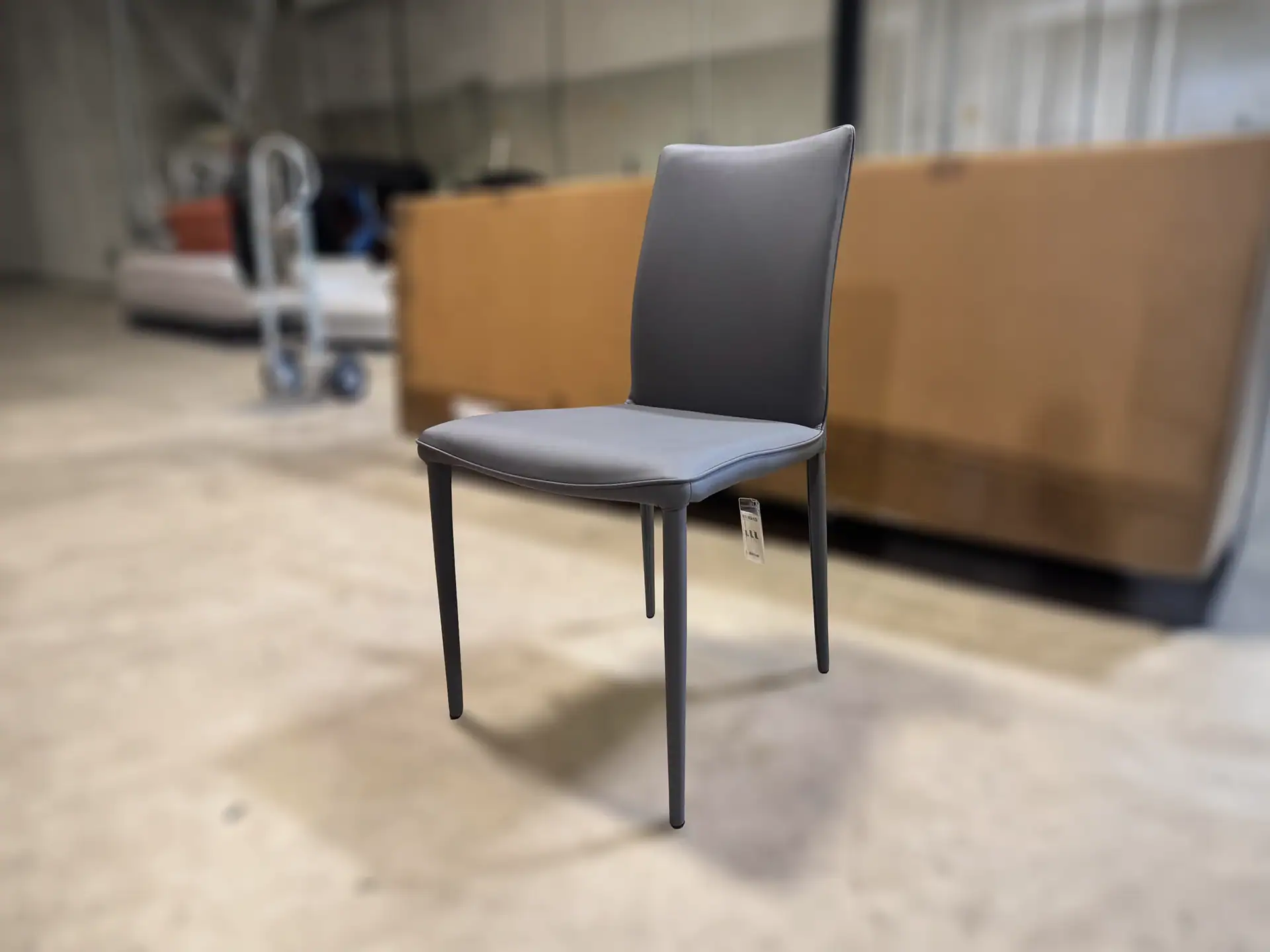 Bontempi Shefi Flex dining chair with grey upholstery and black metal legs.