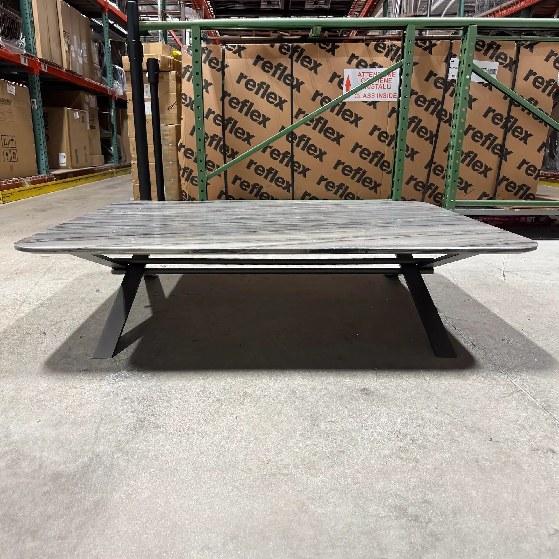 Sklar Furnishings coffee table in warehouse setting.