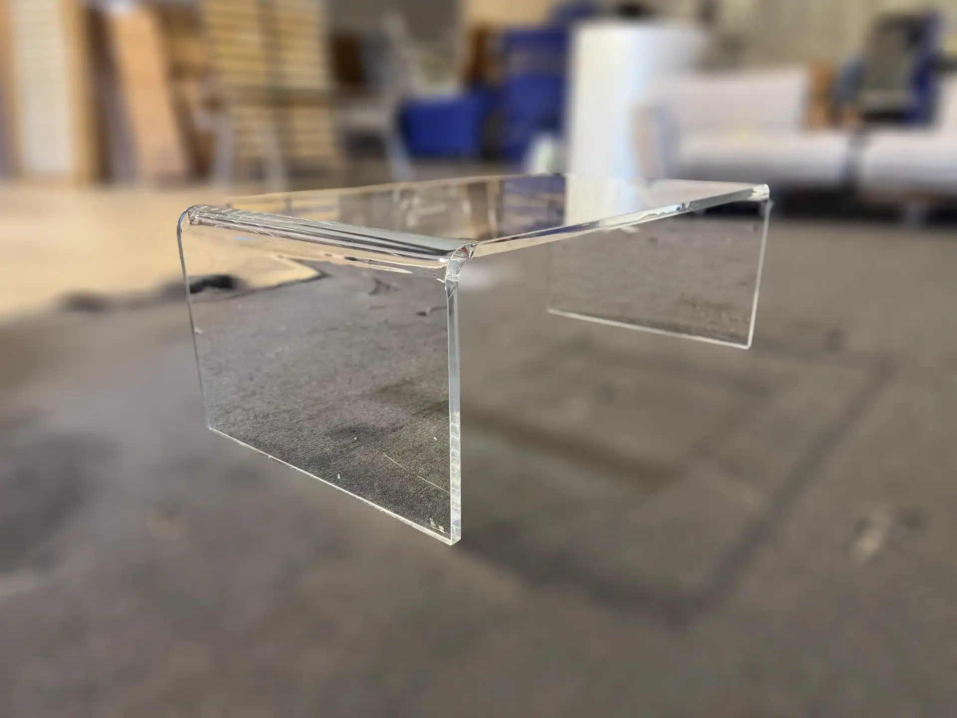 Sklar Furnishings acrylic coffee table in a furniture store.