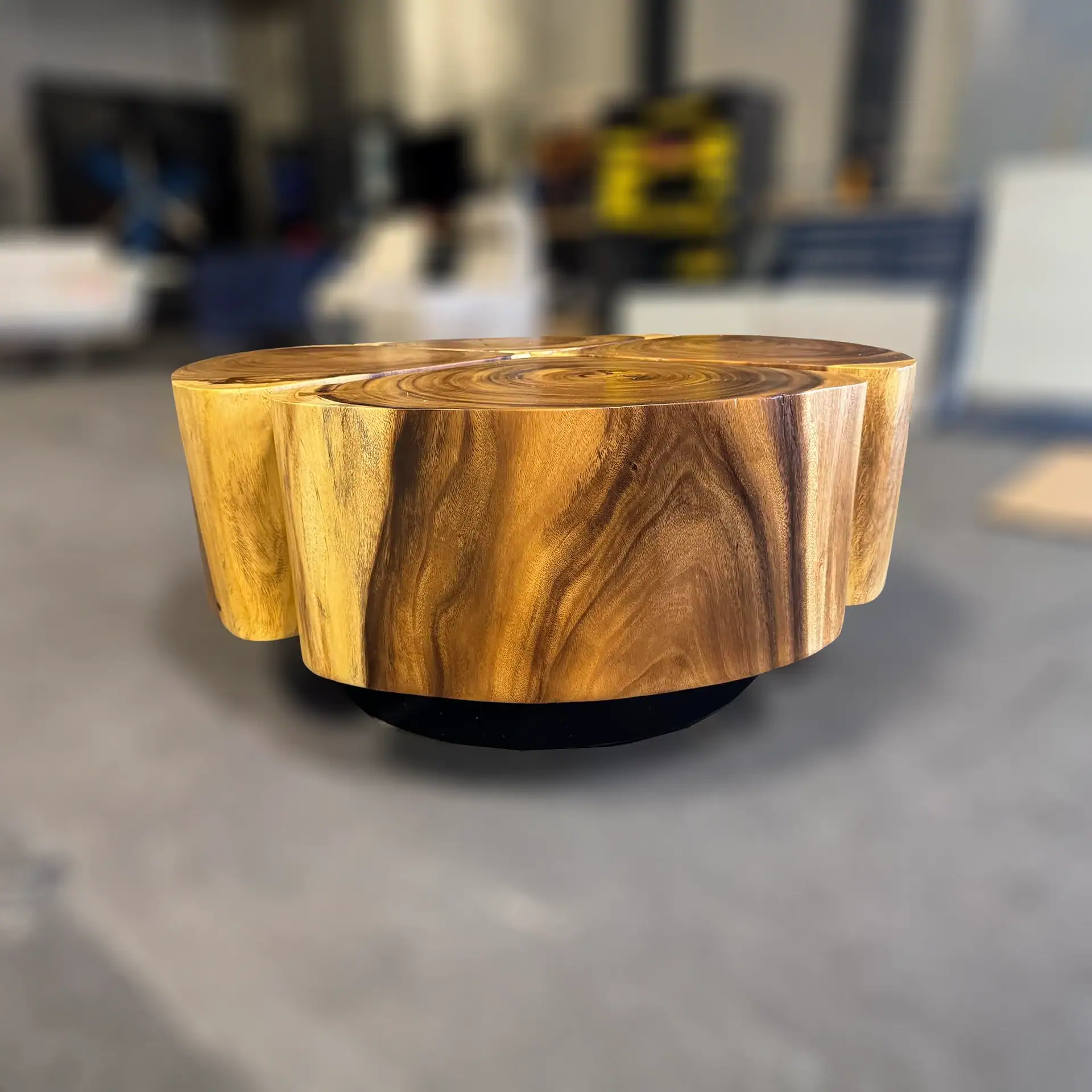 Sklar Furnishings wooden coffee table with a natural finish in a workshop setting.