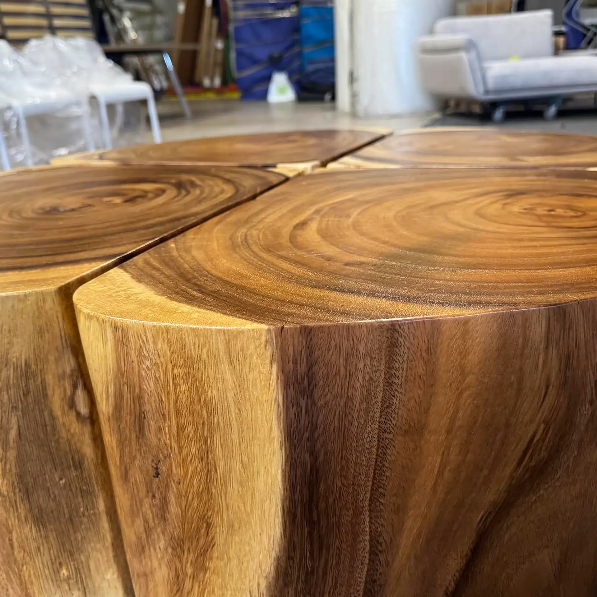 Close-up of a wooden coffee table with natural grain and rounded edges.