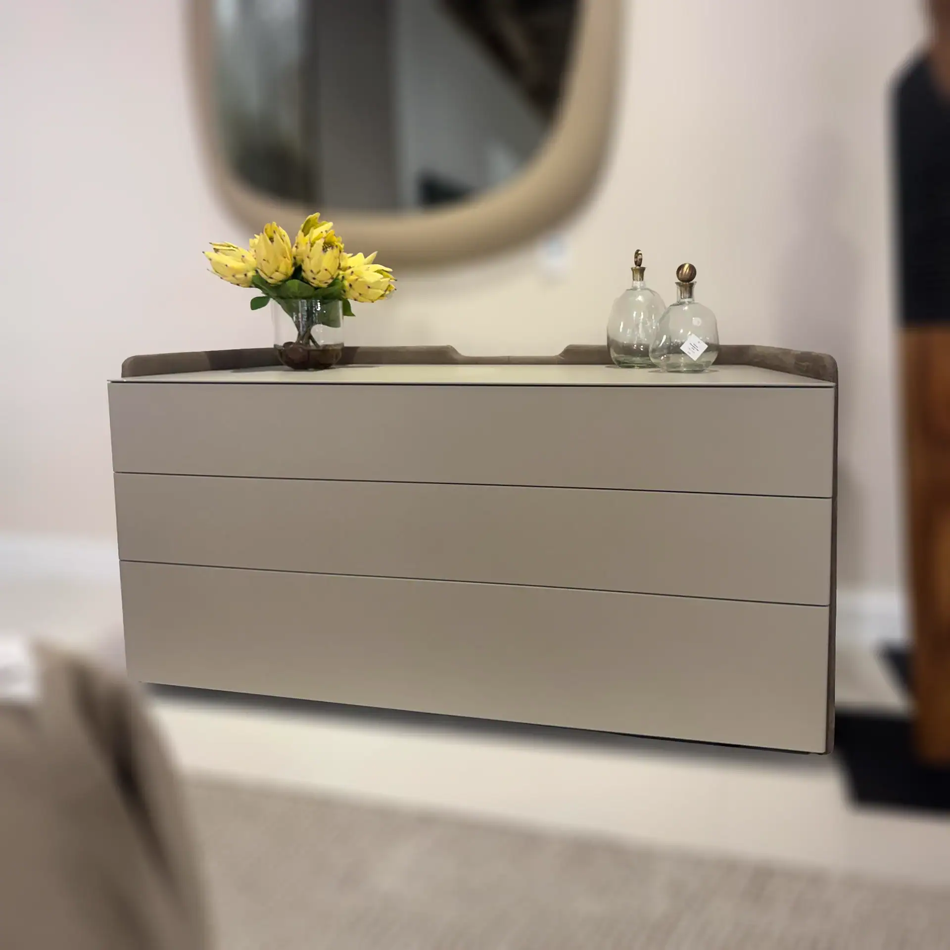 Pianca Chloe 3-Drawer Dresser with decorative vases and flowers on top.