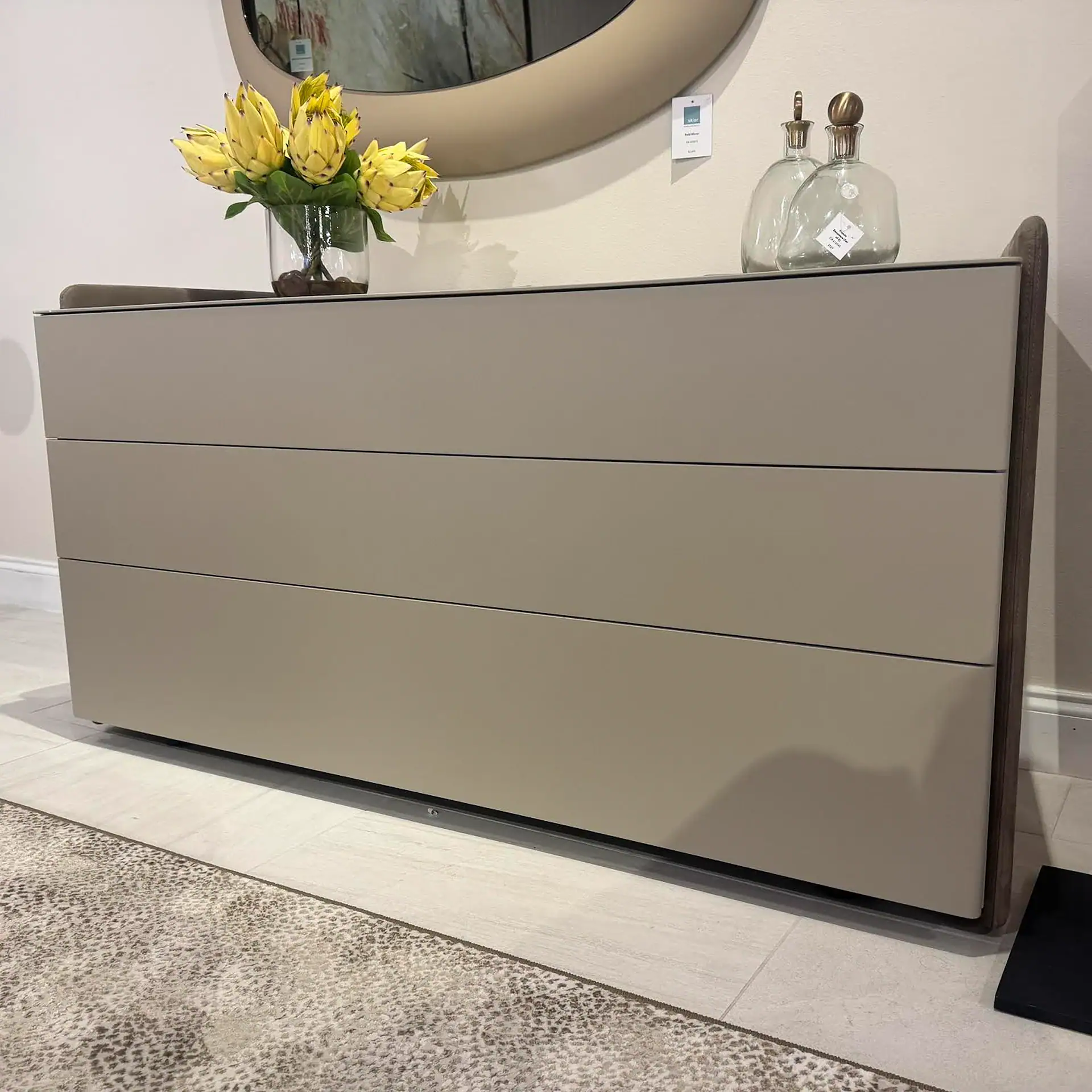 Pianca Chloe 3-Drawer Dresser in a modern room setting with decorative vases and flowers.