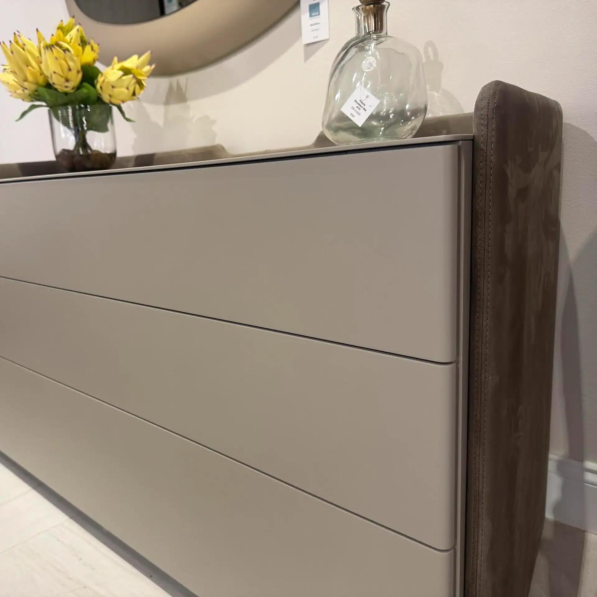 Pianca Chloe 3-Drawer Dresser with a brown upholstered side.