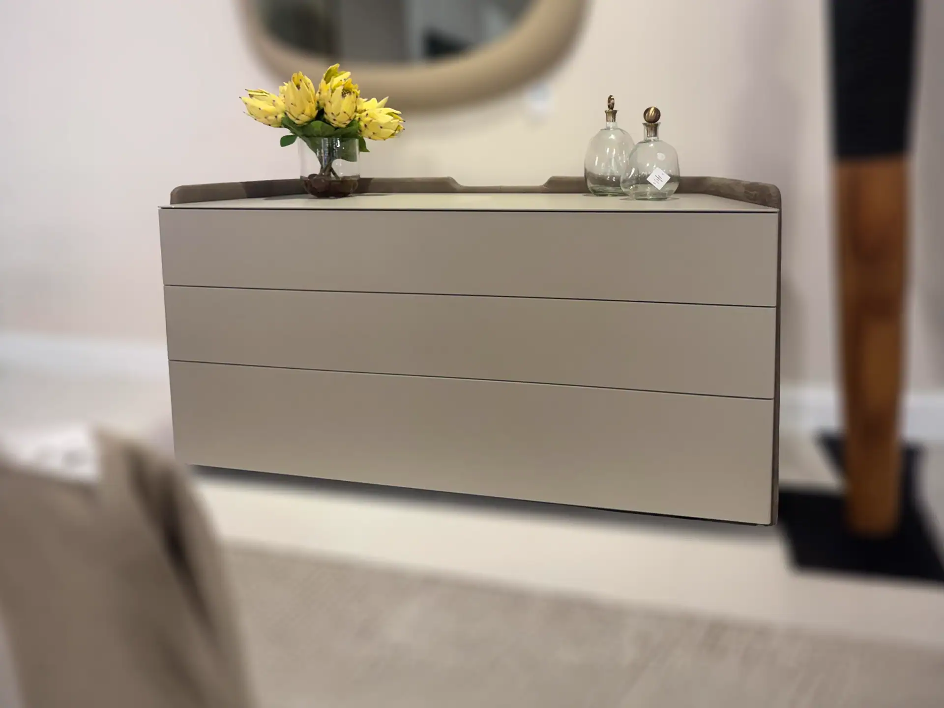 Pianca Chloe 3-Drawer Dresser with decorative vases and flowers on top.