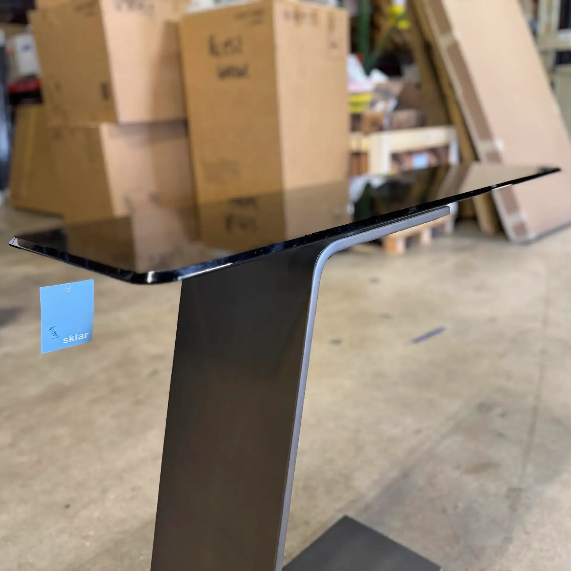 Sklar Furnishings Reflex OH Console Table in a warehouse setting.