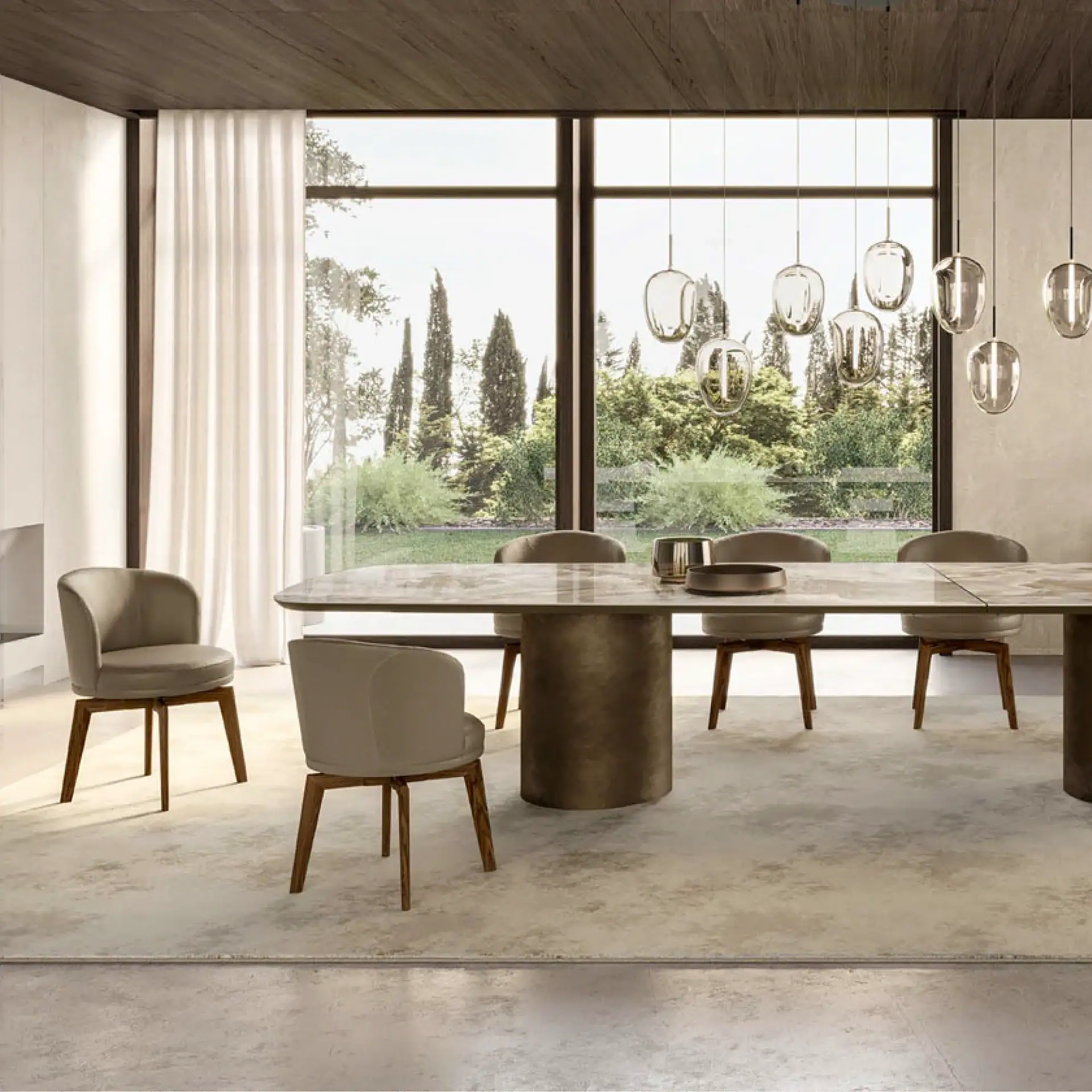 Ginger Dining Chair in a modern dining room with large windows and pendant lighting.
