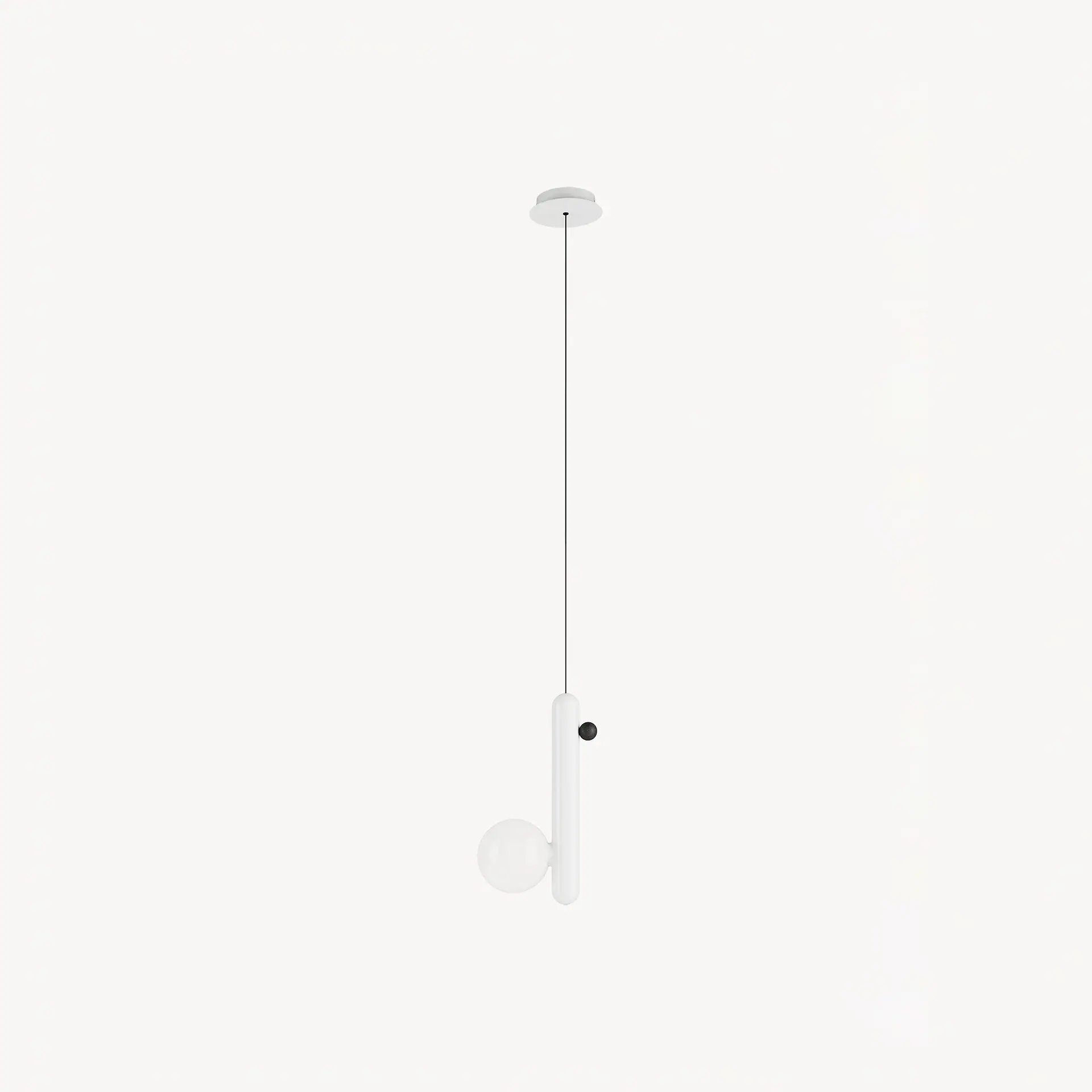 A minimalist pendant light with a white cylindrical body, a black accent, and a spherical white glass globe, hanging from a black cord.