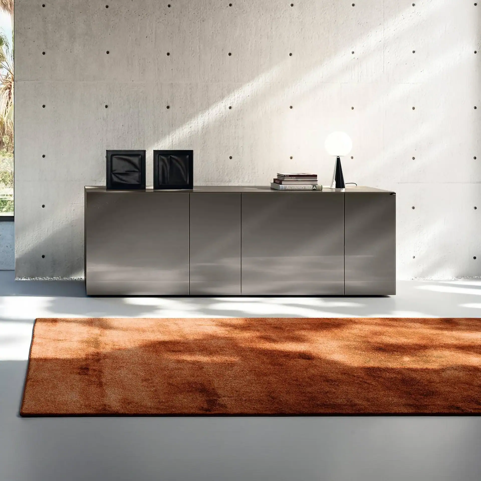 Sklar Furnishings modular sideboard with decorative items in modern room.