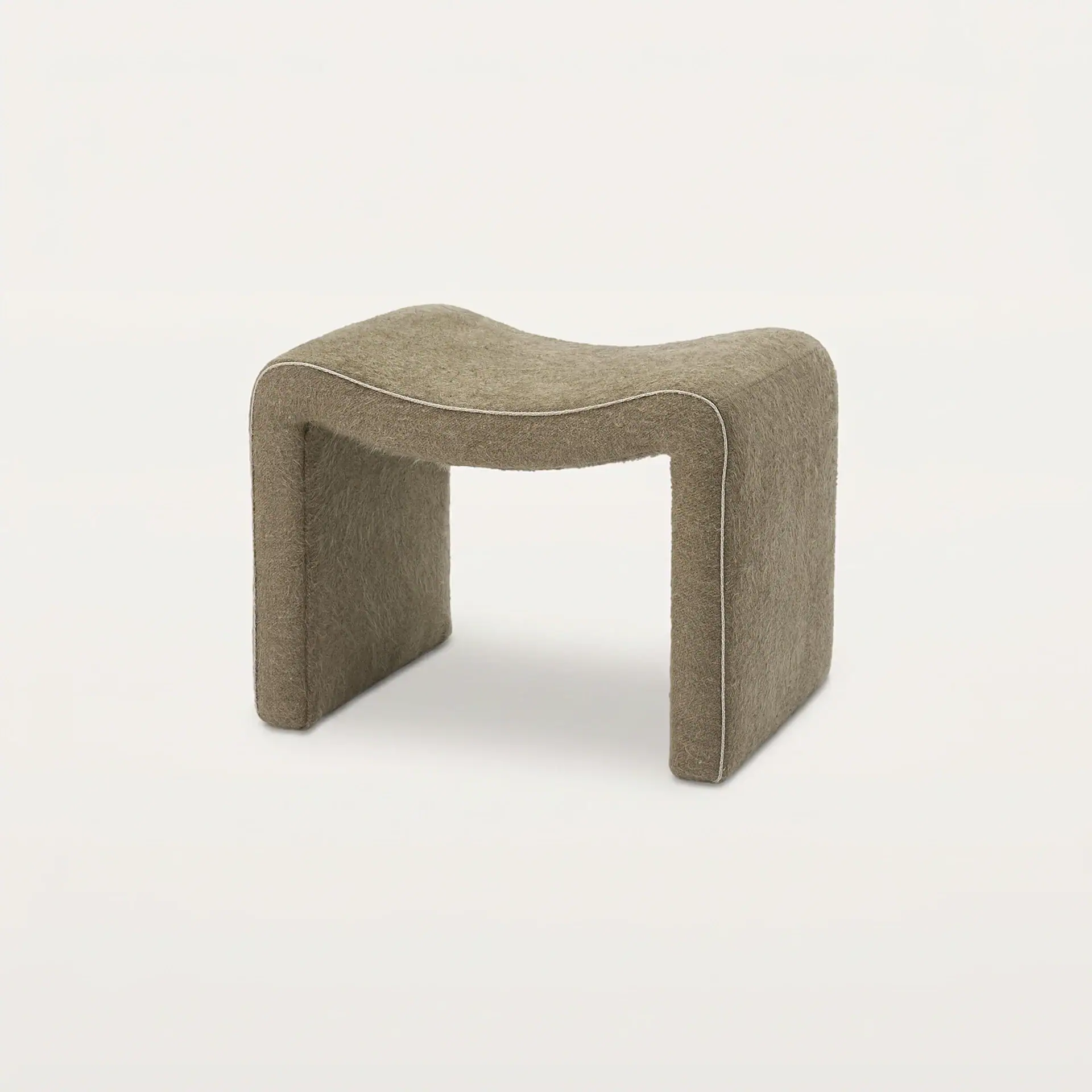 Sklar Furnishings Isla Ottoman in neutral fabric with piping detail.